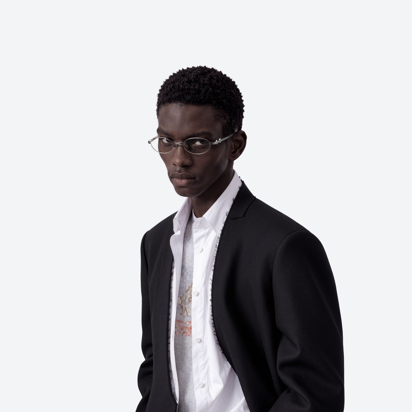 Model wearing the Maison Margiela - MM321 02 Silver Metal framed Oval glasses.
