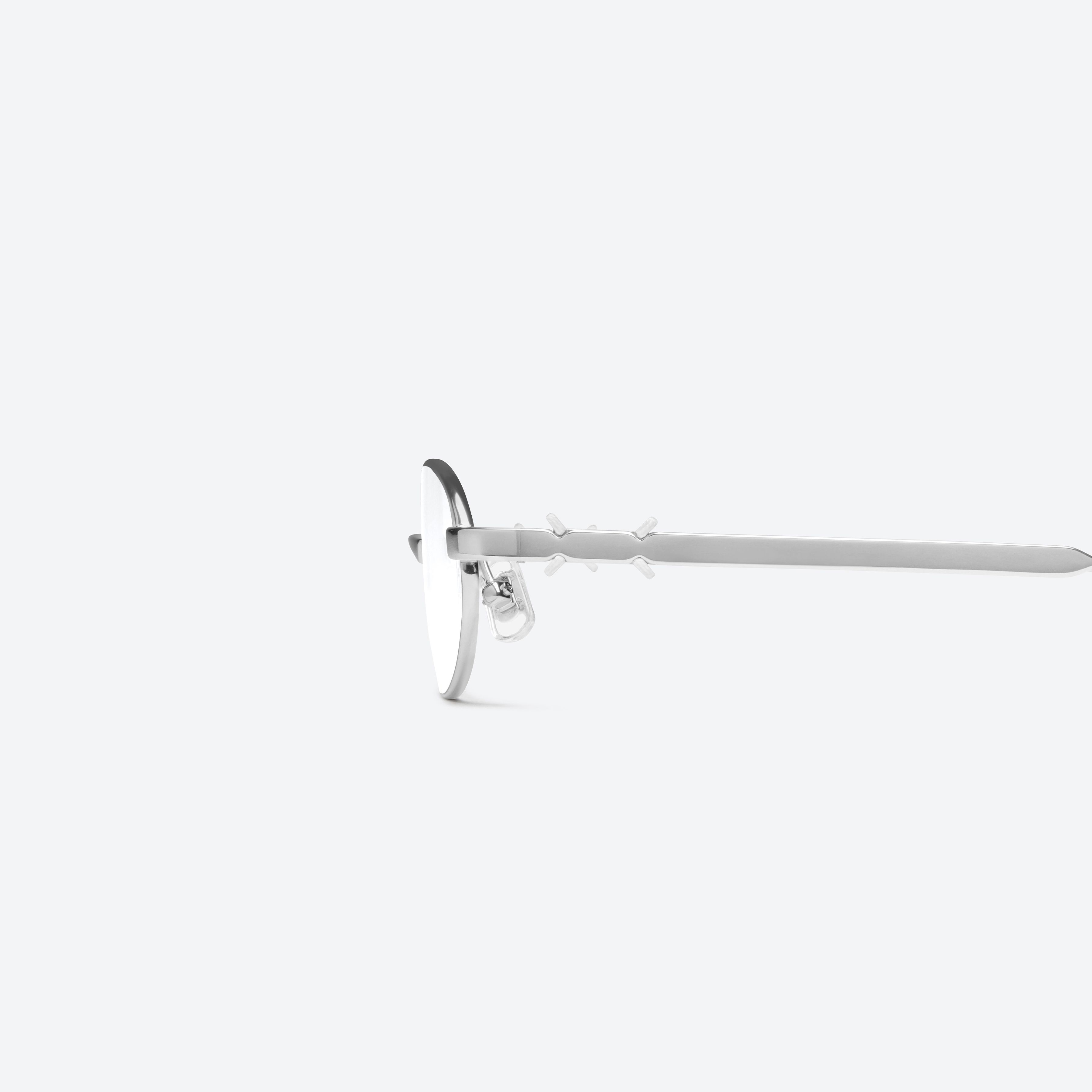 A detailed left view of Gentle Monster Maison Margiela - MM321 02 Silver Metal framed Oval glasses.