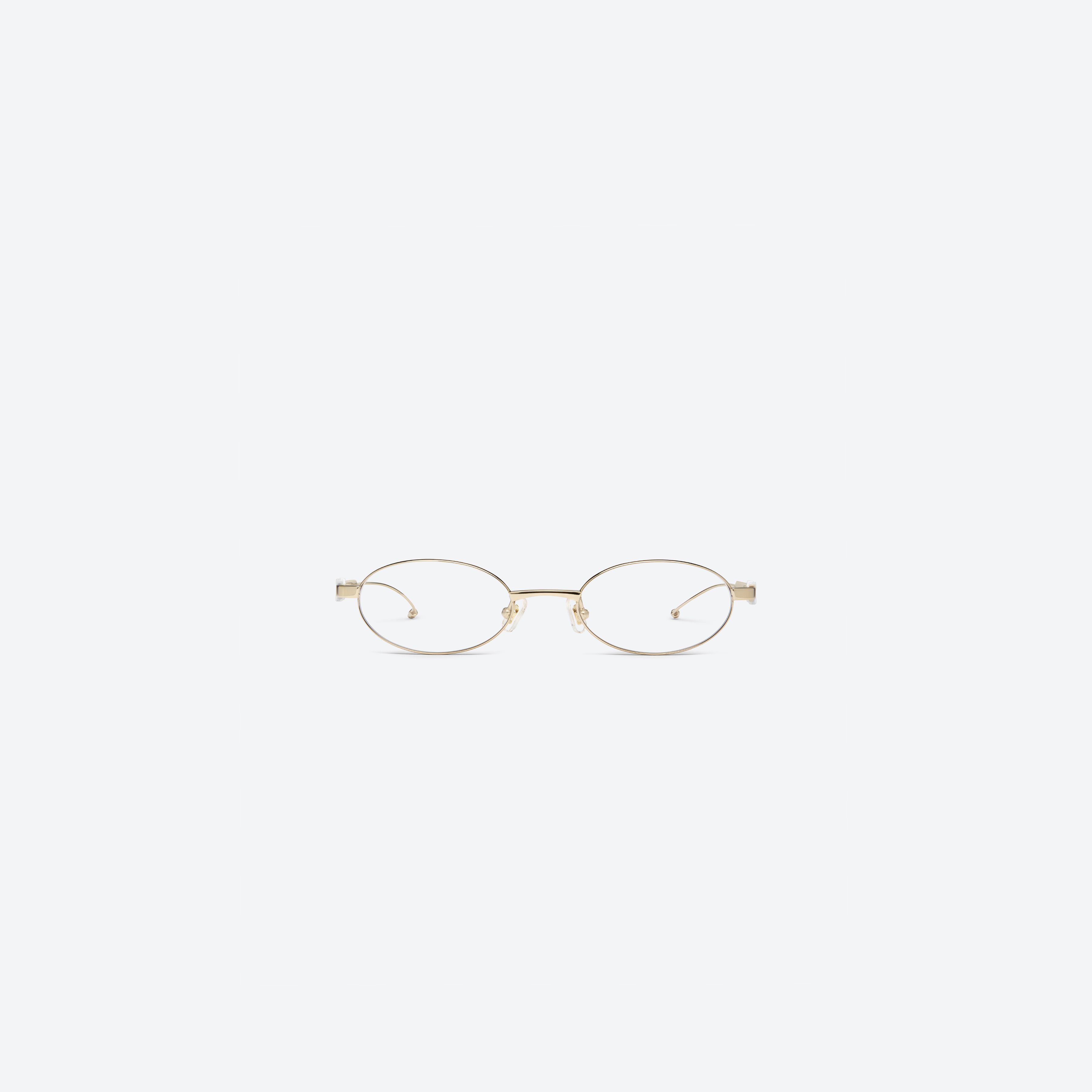 A front view of Gentle Monster Maison Margiela - MM321 039 Gold Metal framed Oval glasses.