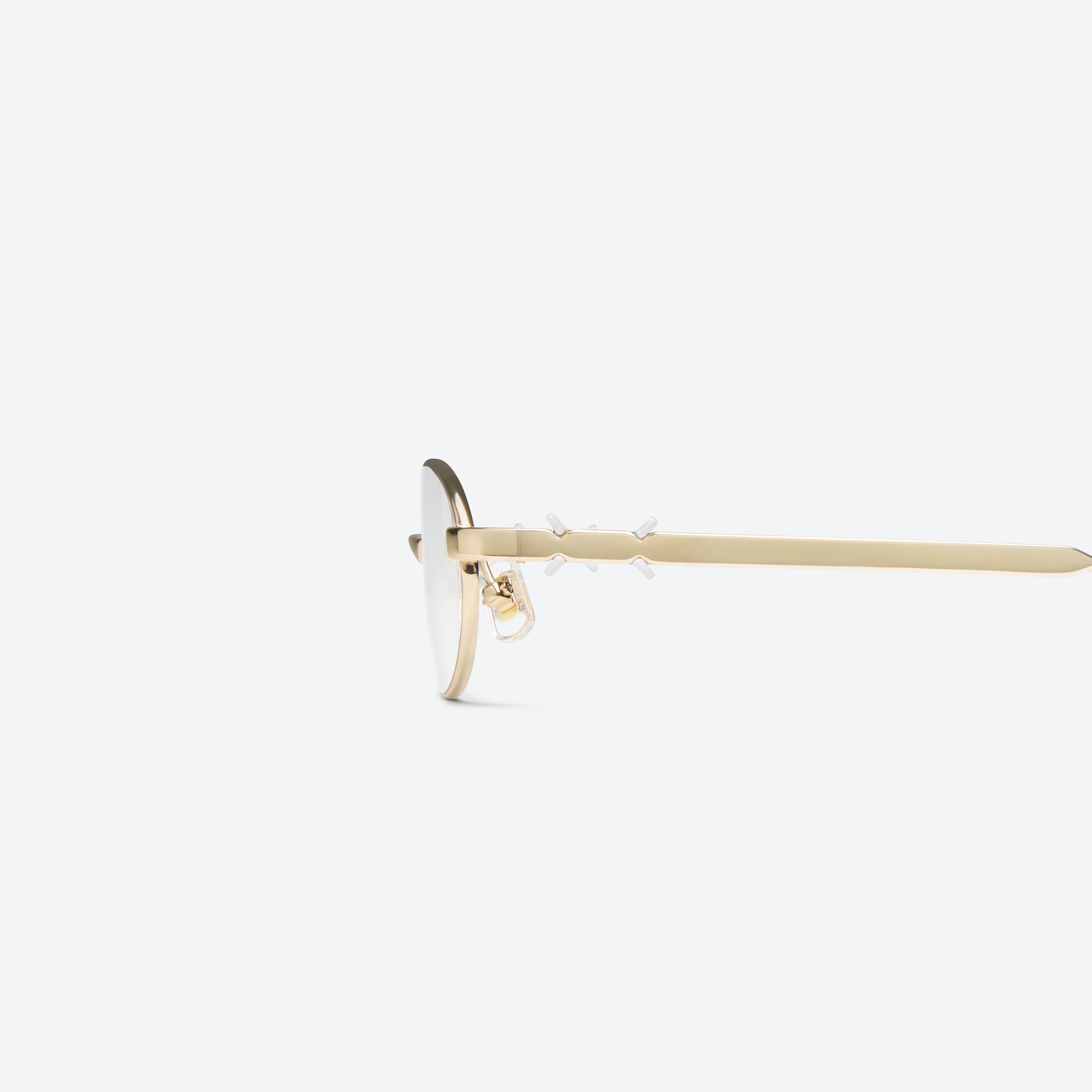 A detailed left view of Gentle Monster Maison Margiela - MM321 039 Gold Metal framed Oval glasses.