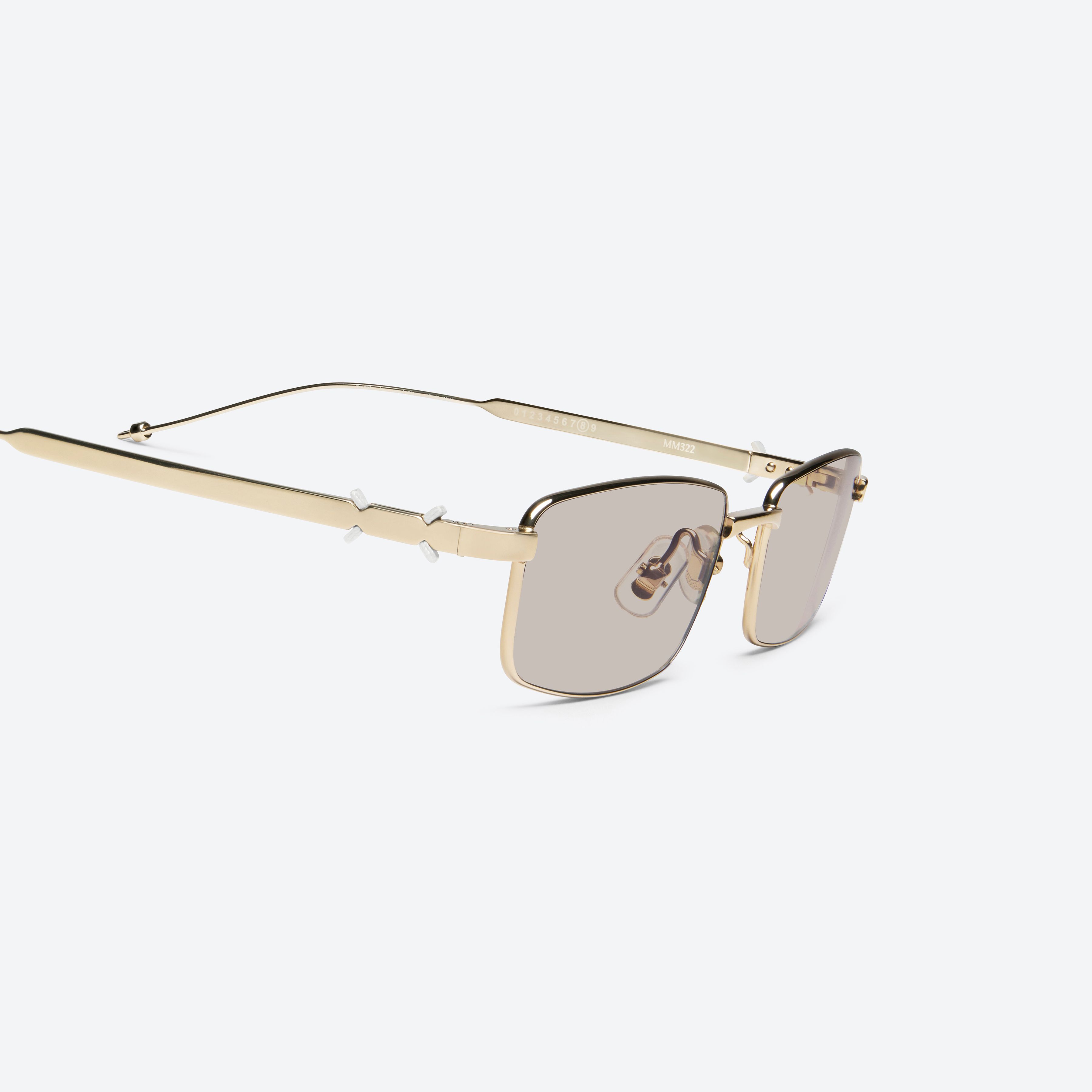 45-degree detailed view of Gentle Monster Maison Margiela - MM322 039 Gold Metal framed Square sunglasses.