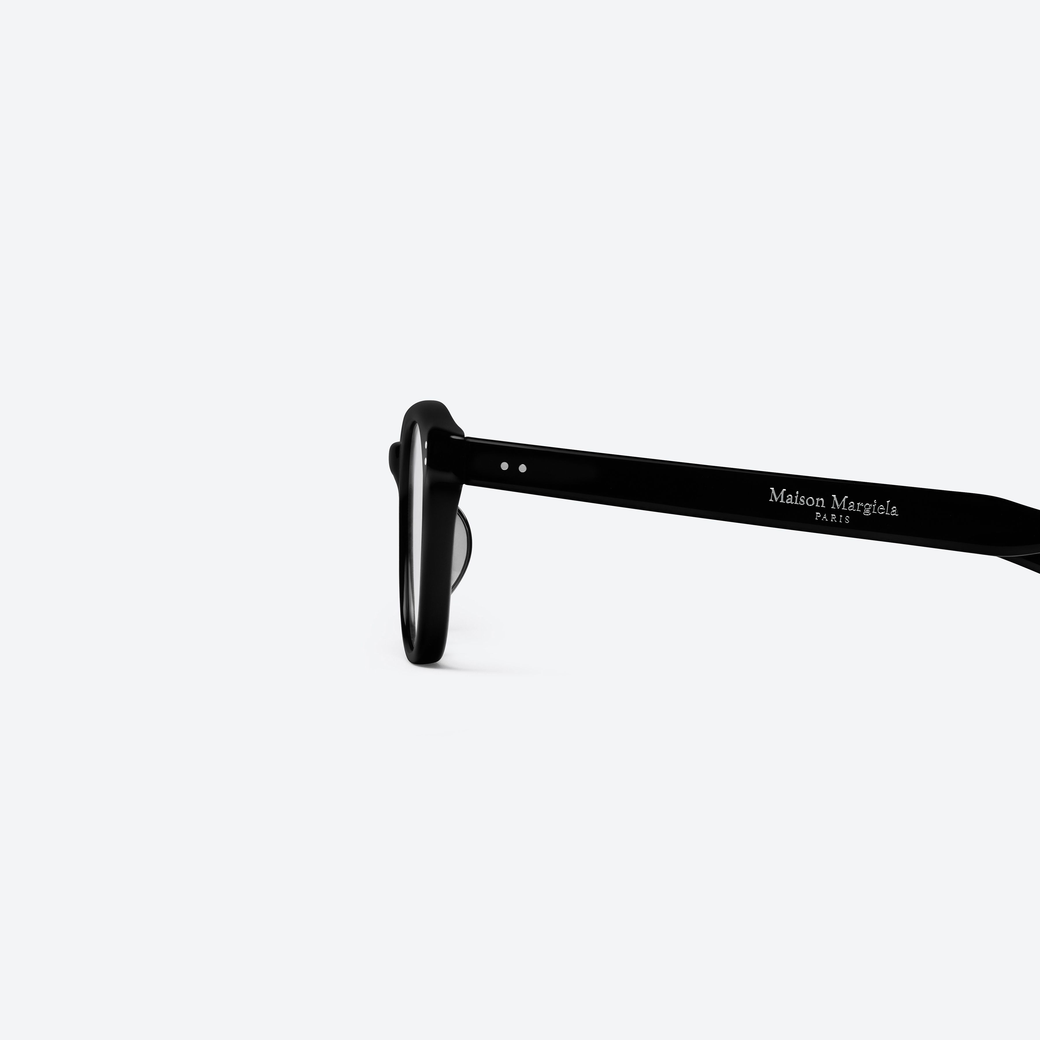 A detailed left view of Gentle Monster Maison Margiela - MM307 01 Black Acetate framed Square glasses.