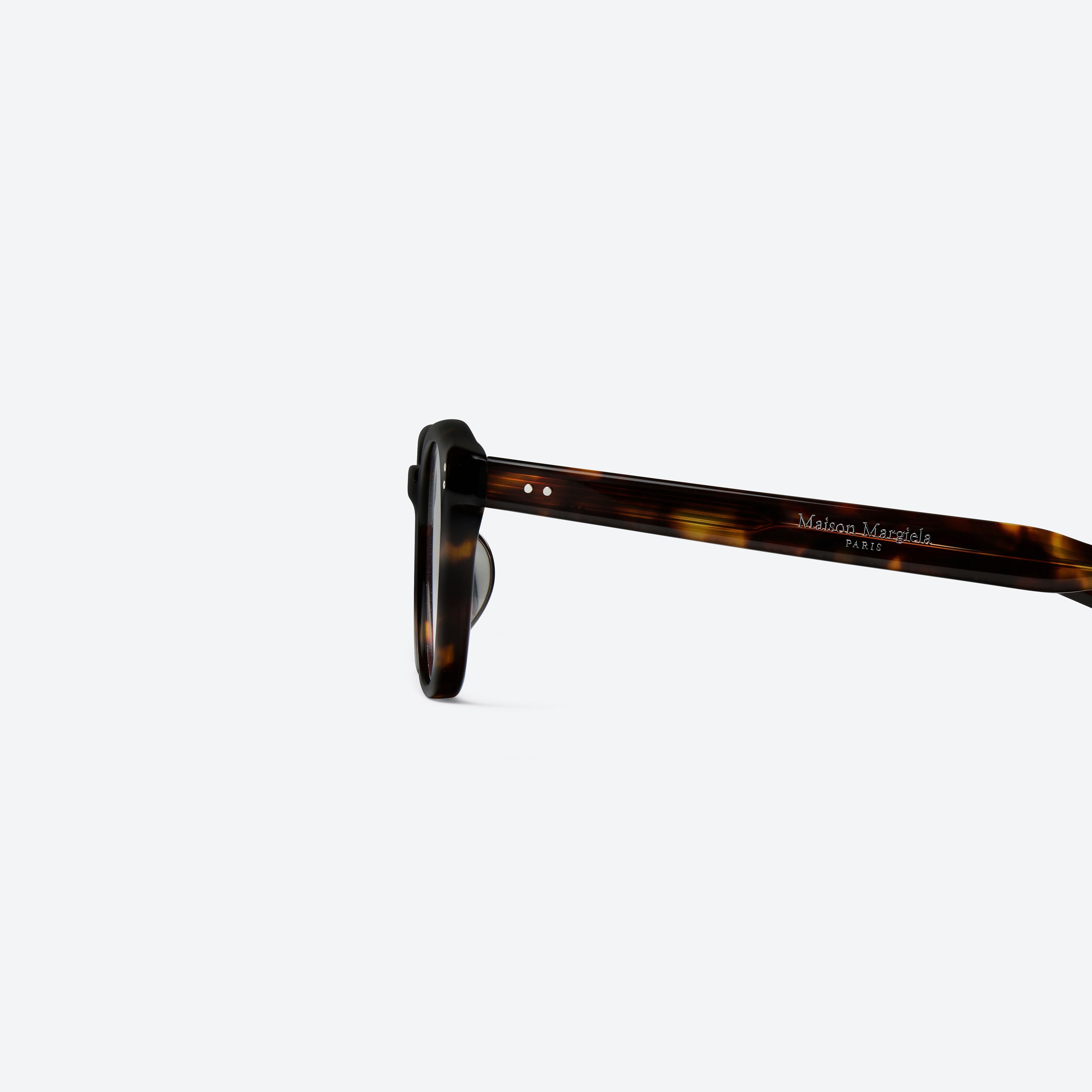 A detailed left view of Gentle Monster Maison Margiela - MM307 T1 Tortoise Acetate framed Square glasses.