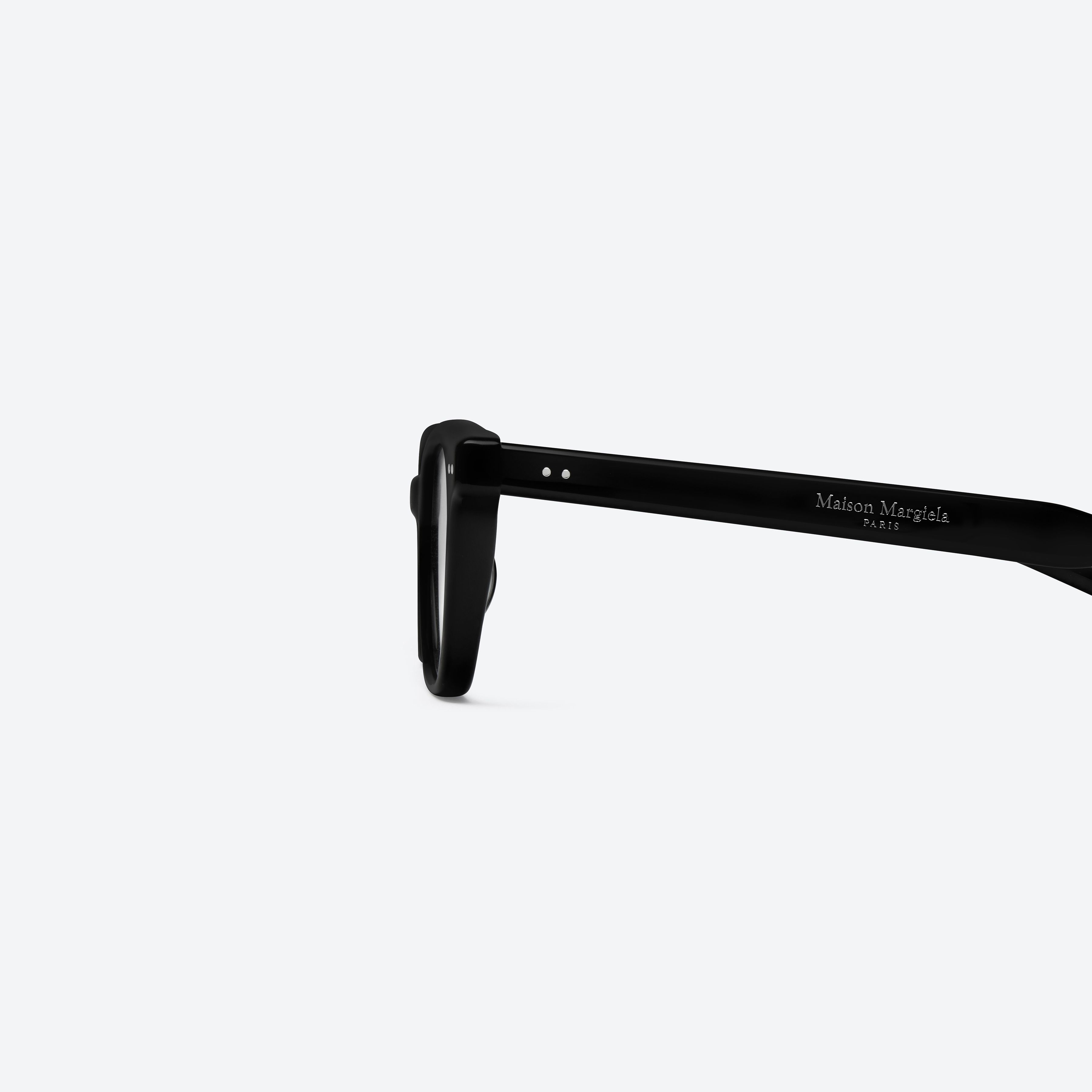A detailed left view of Gentle Monster Maison Margiela - MM308 01 Black Acetate framed Square glasses.
