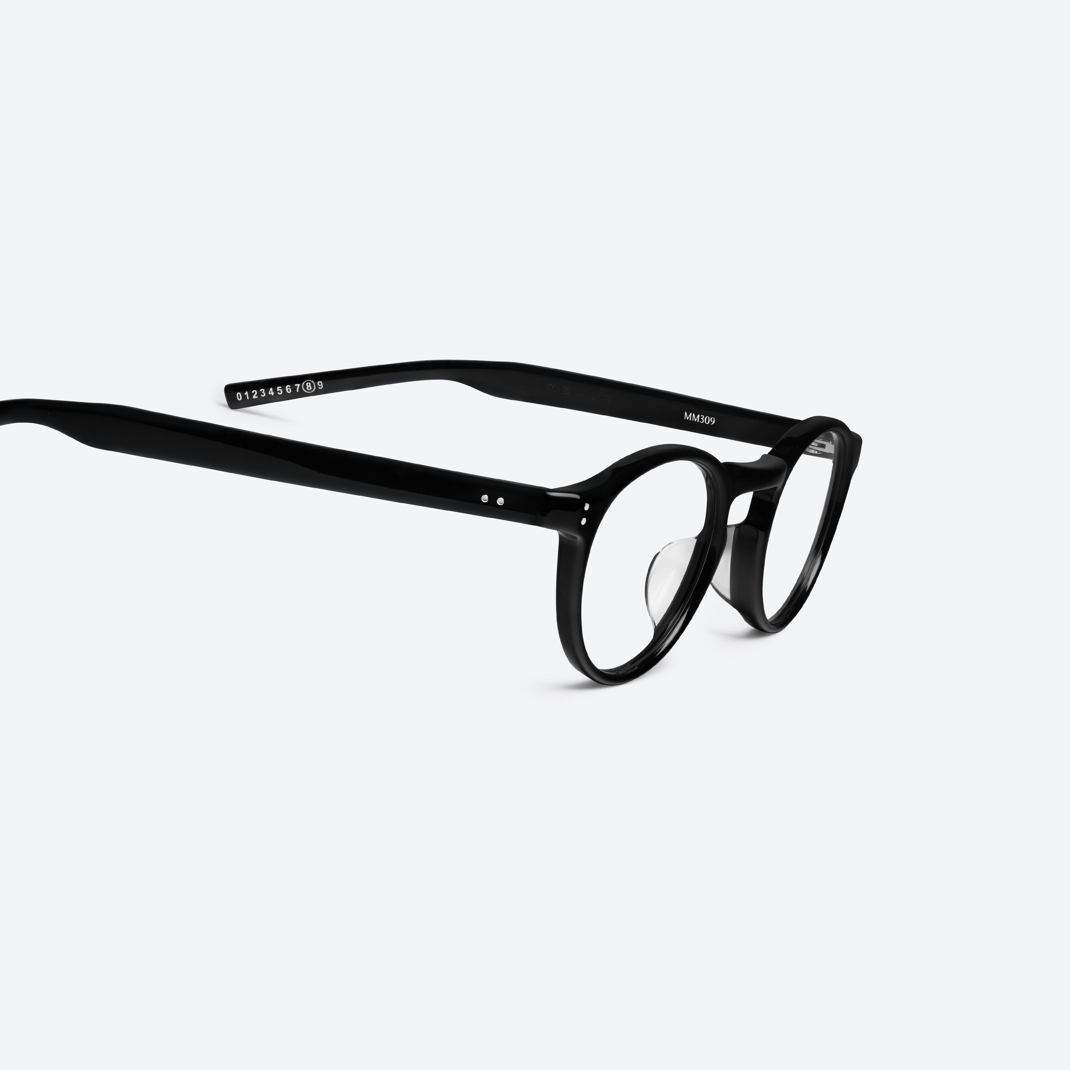 45-degree detailed view of Gentle Monster Maison Margiela - MM309 01 Black Acetate framed Round glasses.