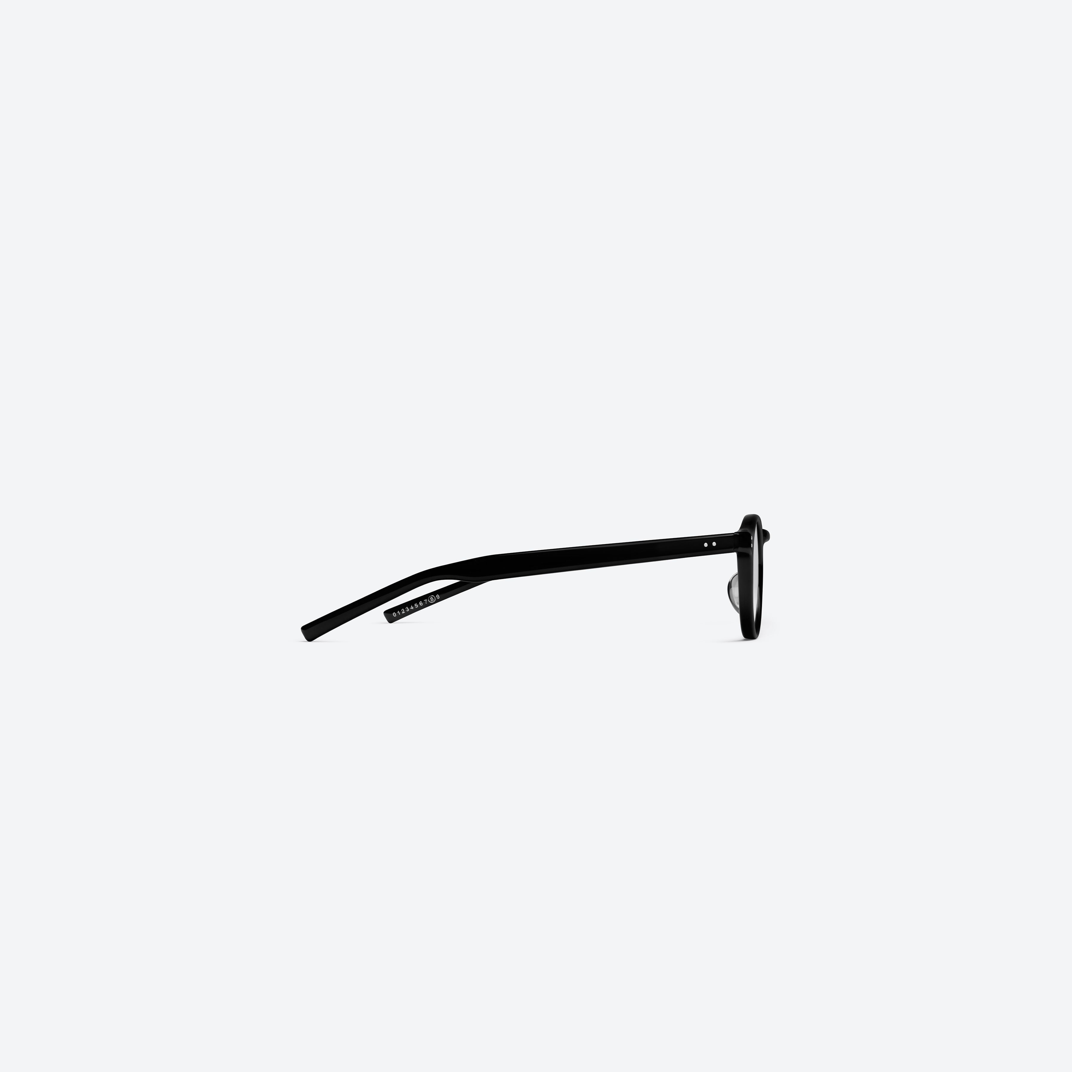 A detailed right view of Gentle Monster Maison Margiela - MM309 01 Black Acetate framed Round glasses.