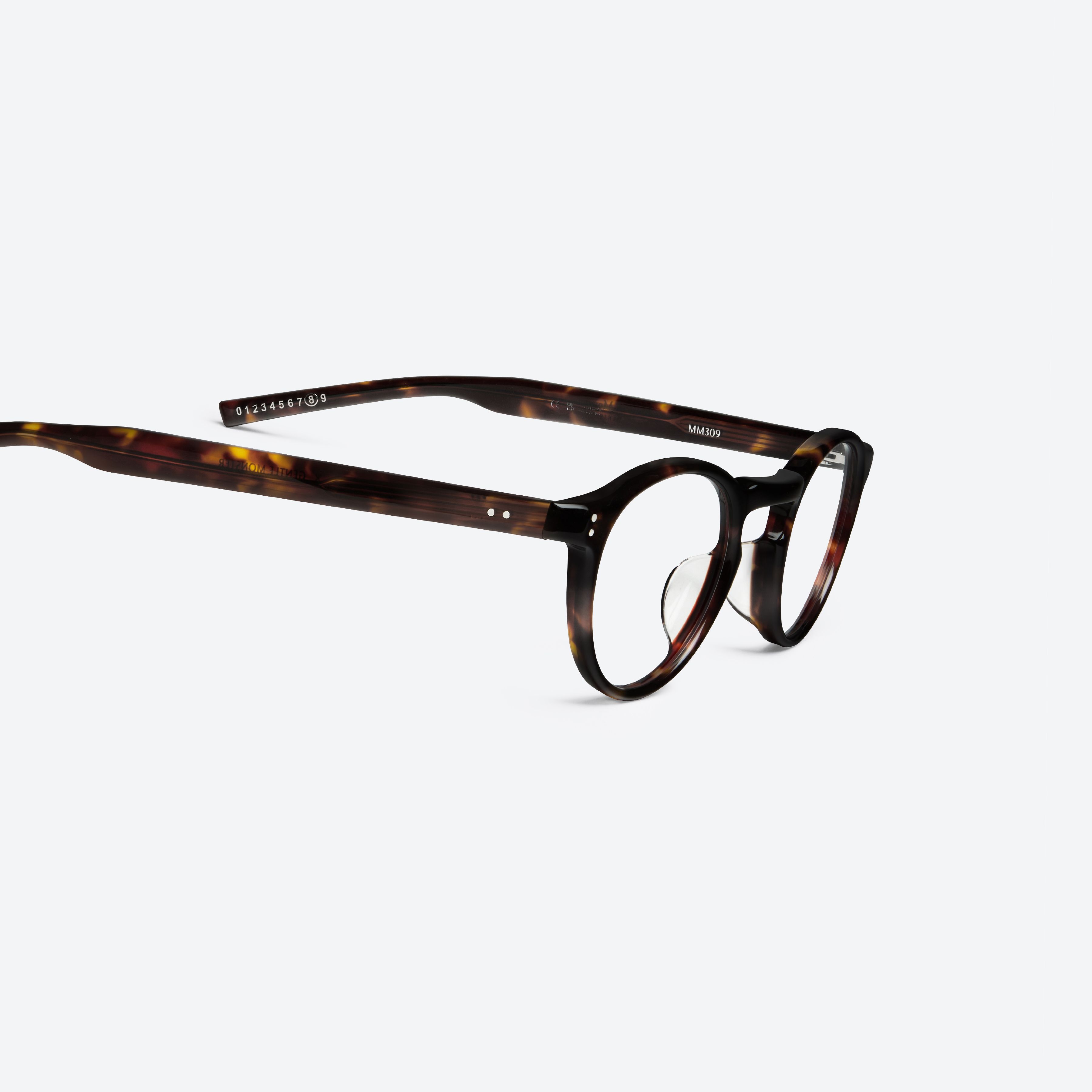 45-degree detailed view of Gentle Monster Maison Margiela - MM309 T1 Tortoise Acetate framed Round glasses.
