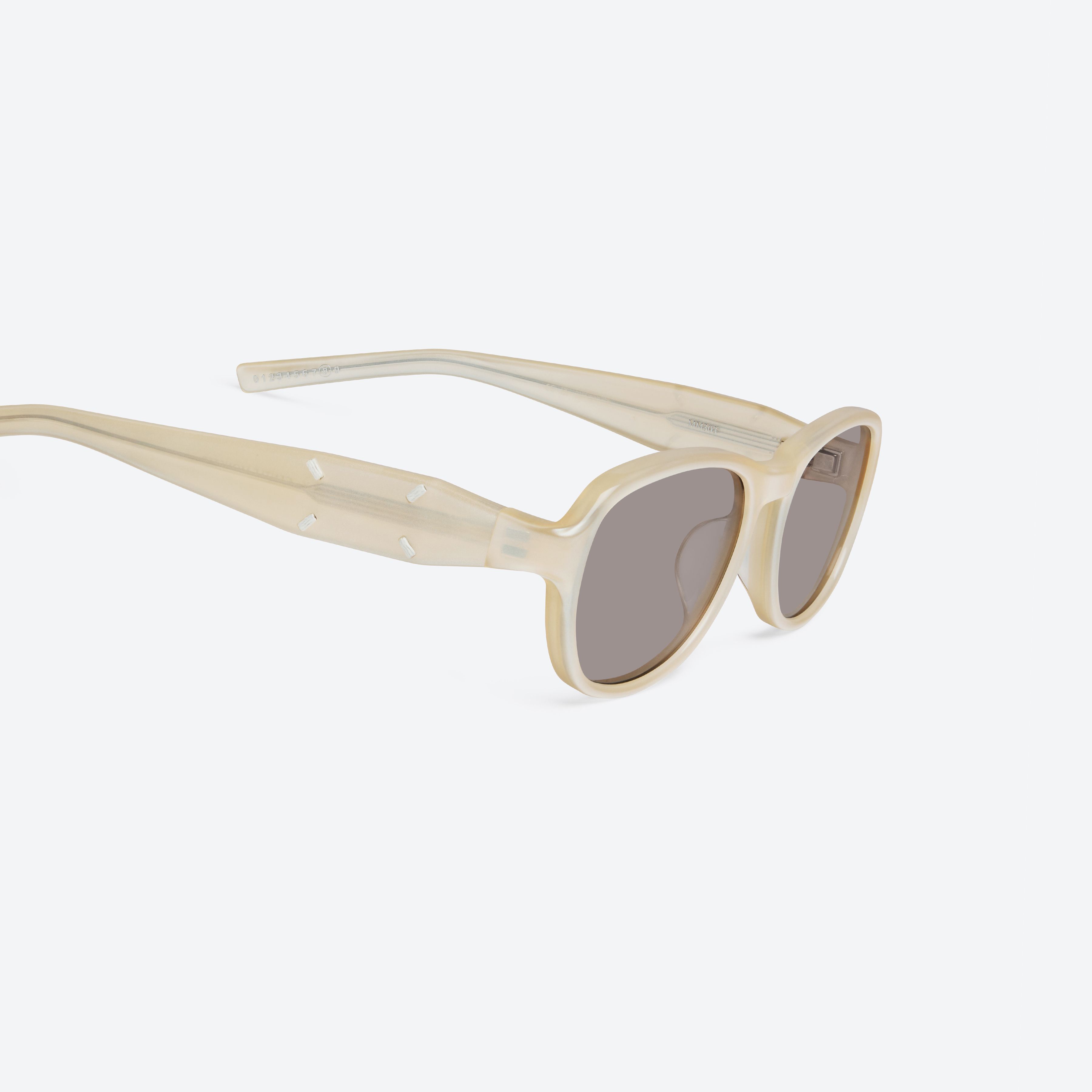 45-degree detailed view of Gentle Monster Maison Margiela - MM303 IC4 Ivory Acetate framed Aviator sunglasses.