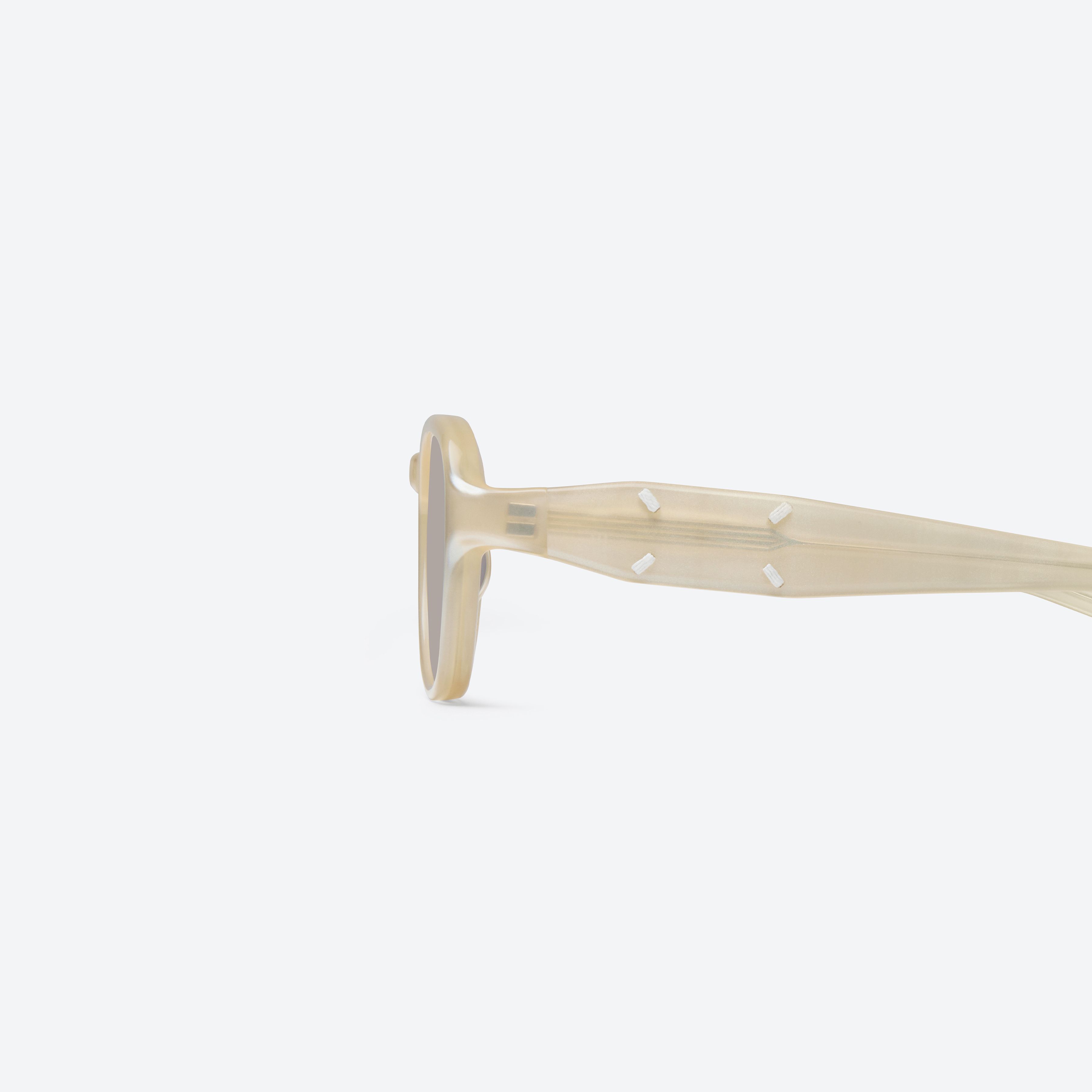 A detailed left view of Gentle Monster Maison Margiela - MM303 IC4 Ivory Acetate framed Aviator sunglasses.