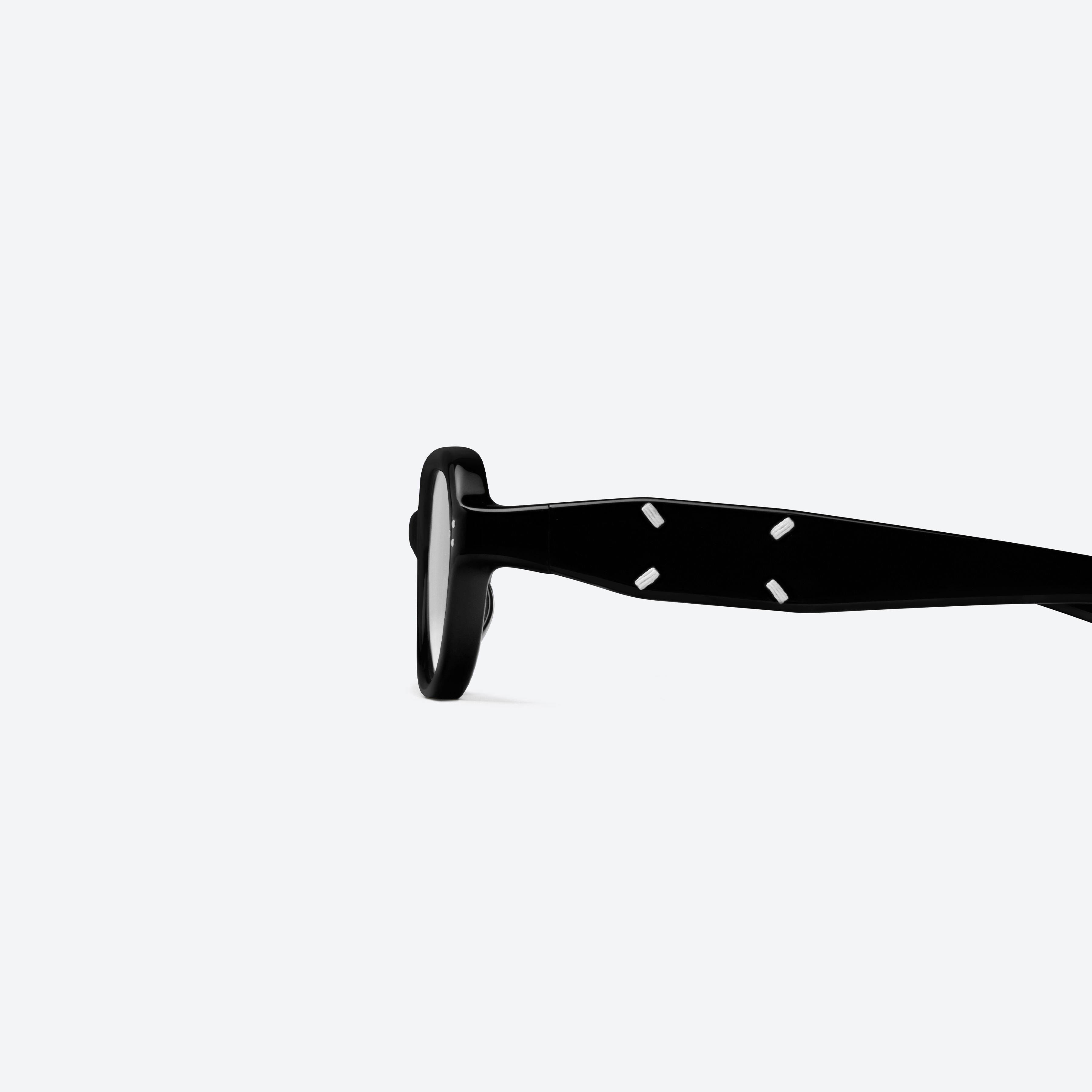 A detailed left view of Gentle Monster Maison Margiela - MM304 01 Black Acetate framed Aviator glasses.