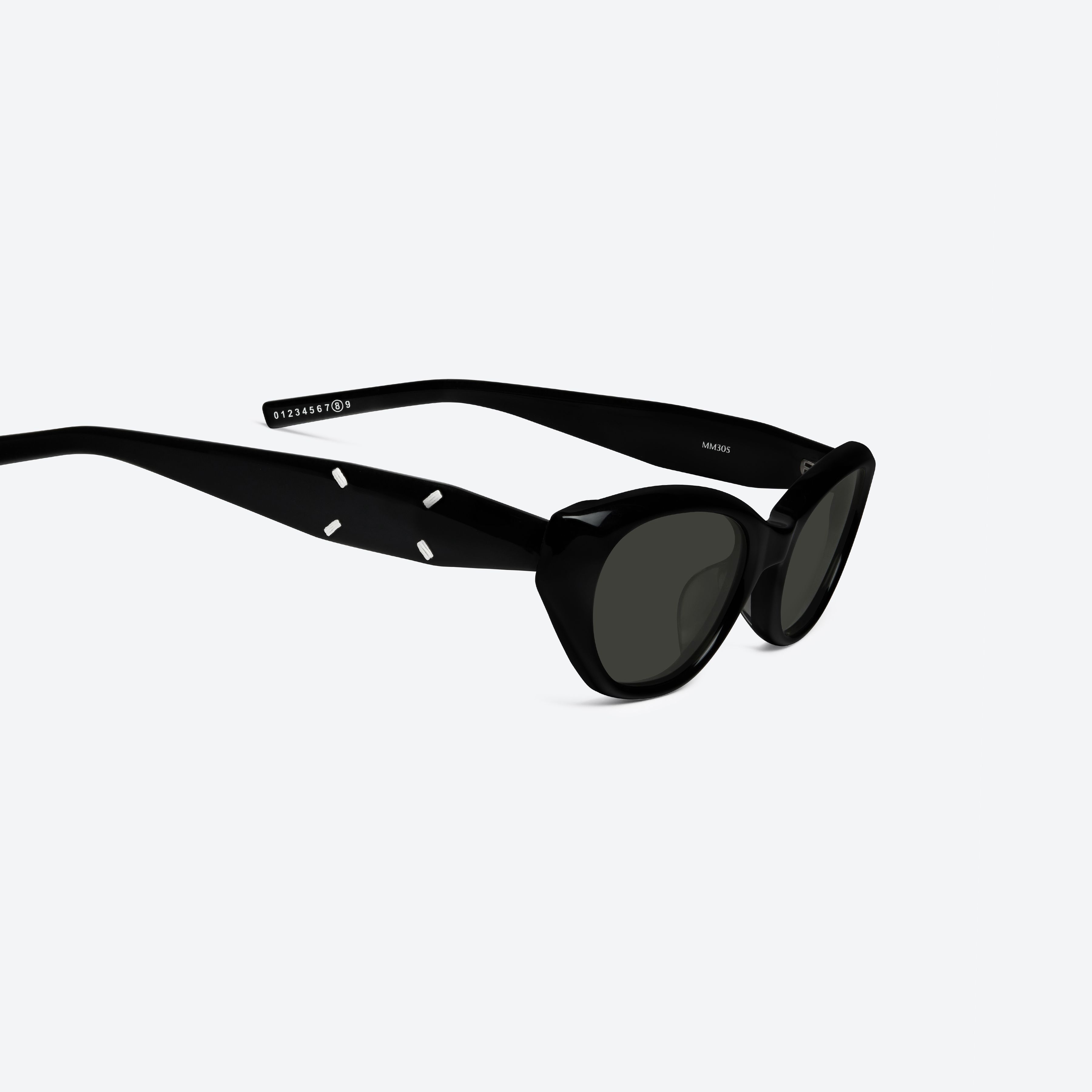 45-degree detailed view of Gentle Monster Maison Margiela - MM305 01 Black Acetate framed Cat-eye sunglasses.