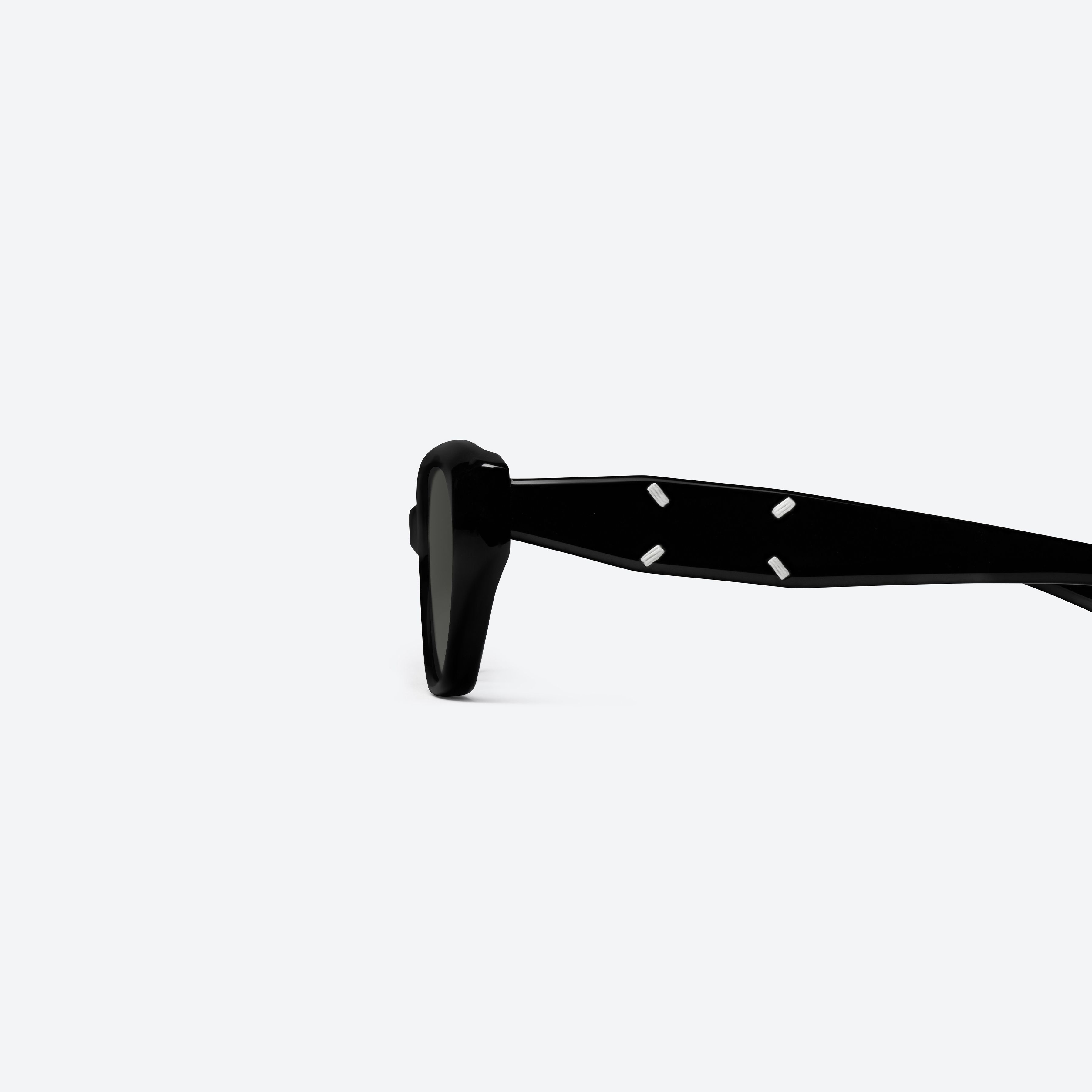 A detailed left view of Gentle Monster Maison Margiela - MM305 01 Black Acetate framed Cat-eye sunglasses.