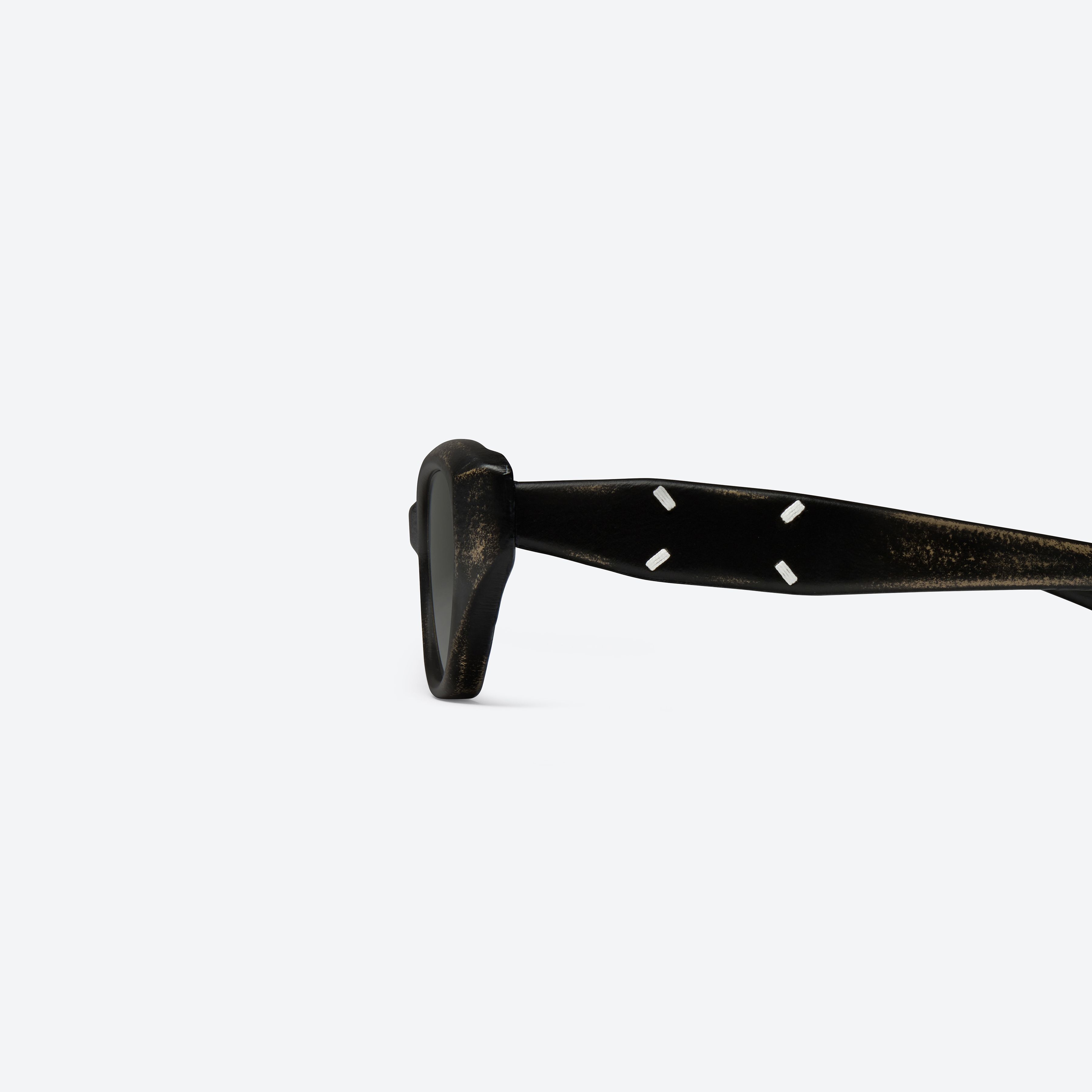A detailed left view of Gentle Monster Maison Margiela - MM305 Leather LBK2 Similar Black Acetate framed Cat-eye sunglasses.