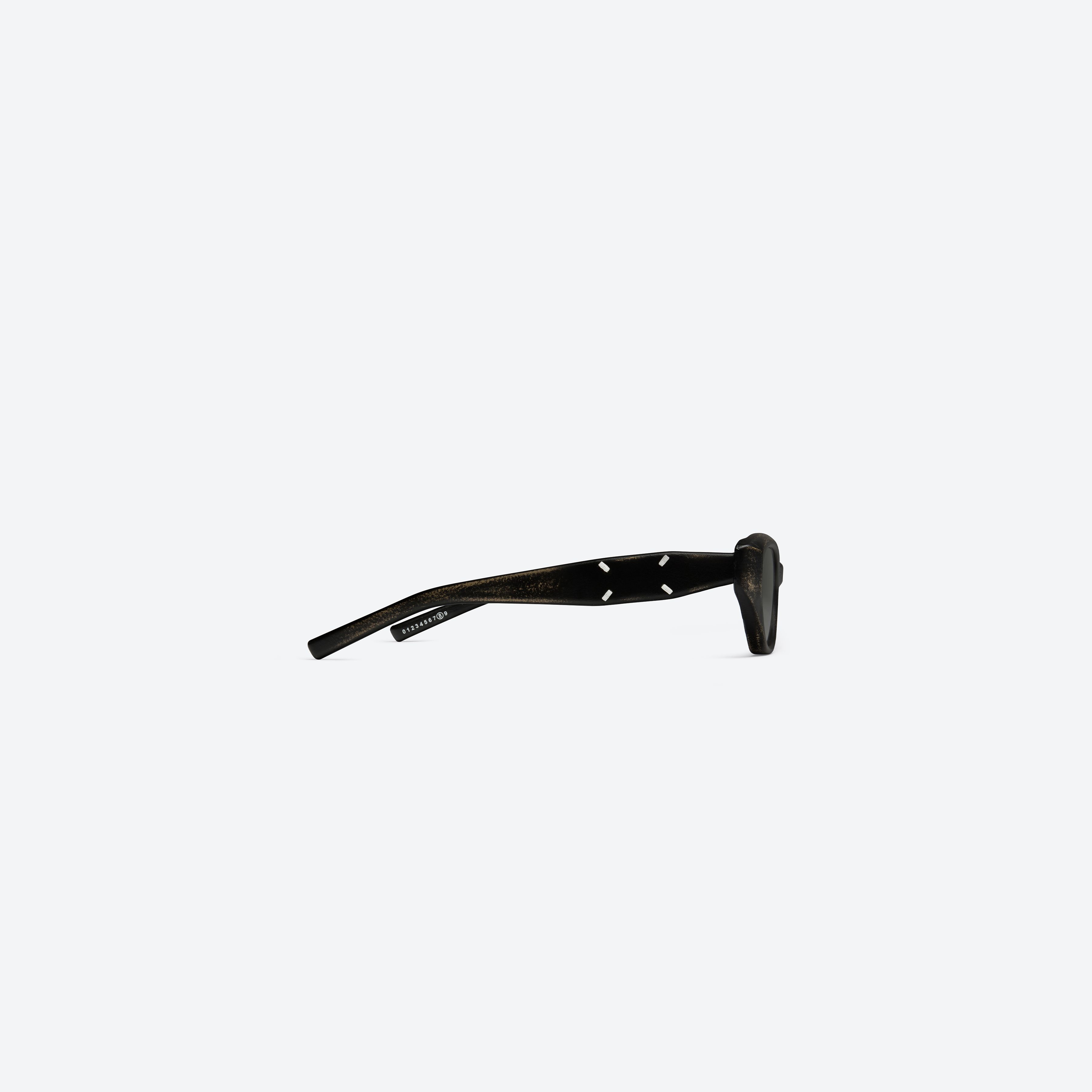 A detailed right view of Gentle Monster Maison Margiela - MM305 Leather LBK2 Similar Black Acetate framed Cat-eye sunglasses.