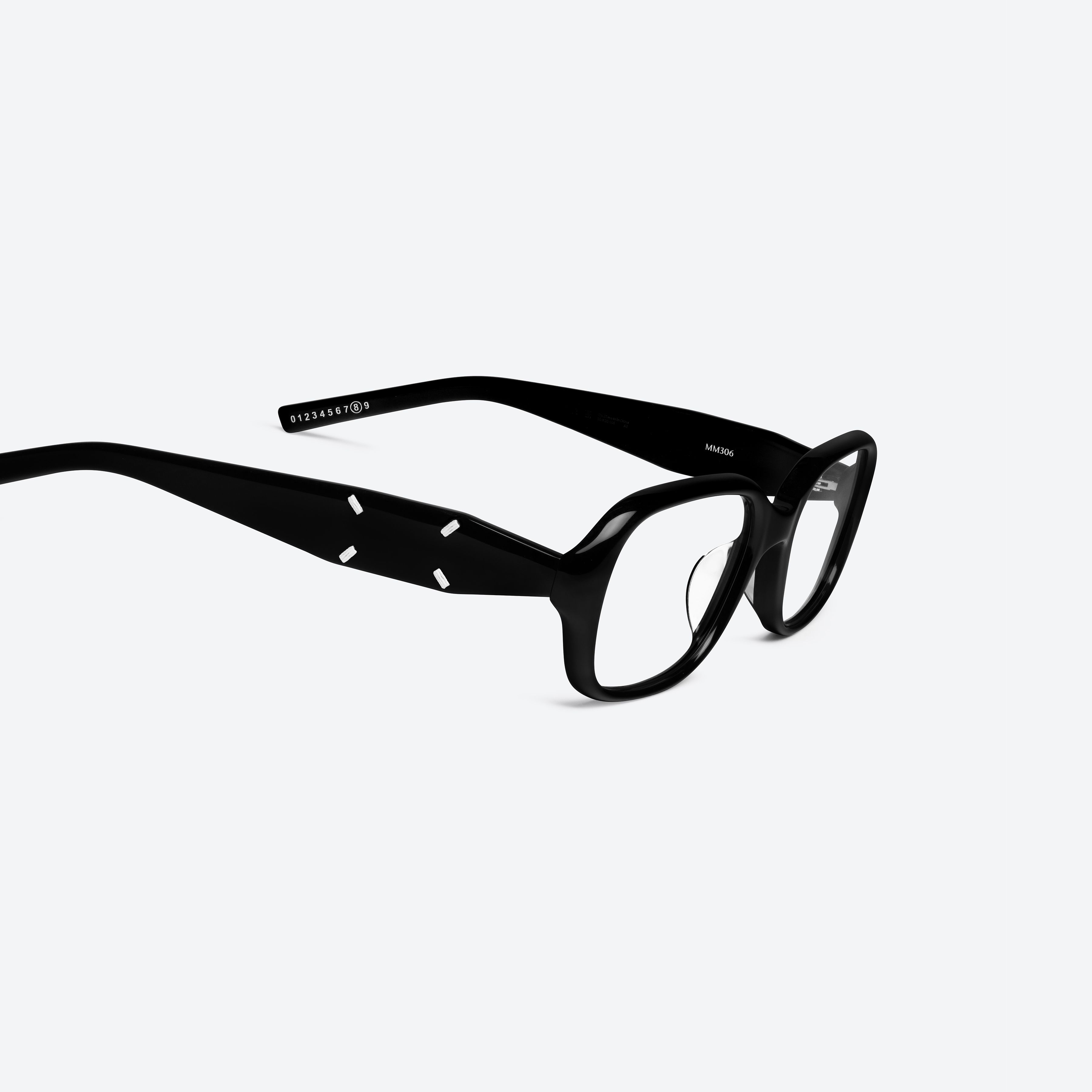 45-degree detailed view of Gentle Monster Maison Margiela - MM306 01 Black Acetate framed Square glasses.