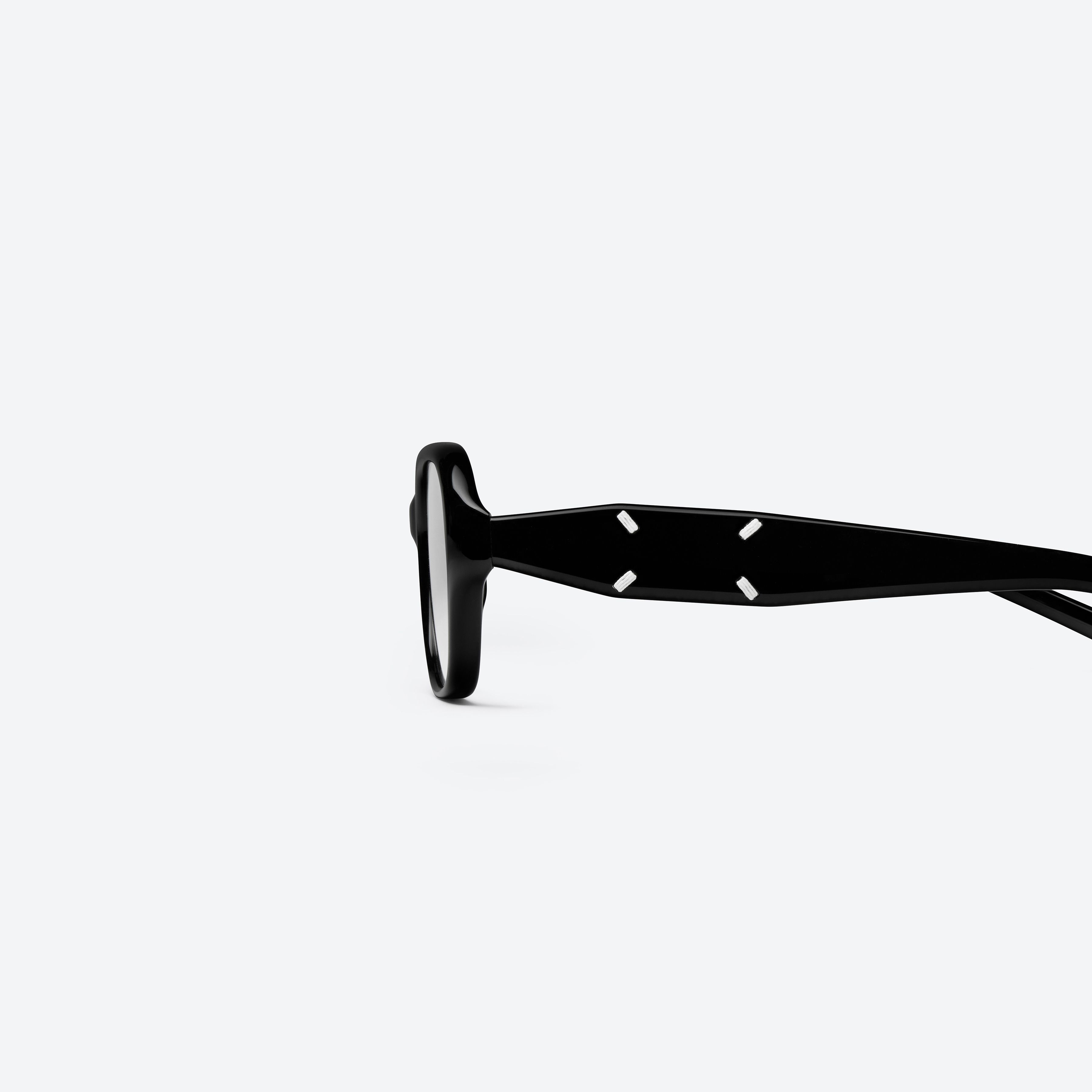 A detailed left view of Gentle Monster Maison Margiela - MM306 01 Black Acetate framed Square glasses.