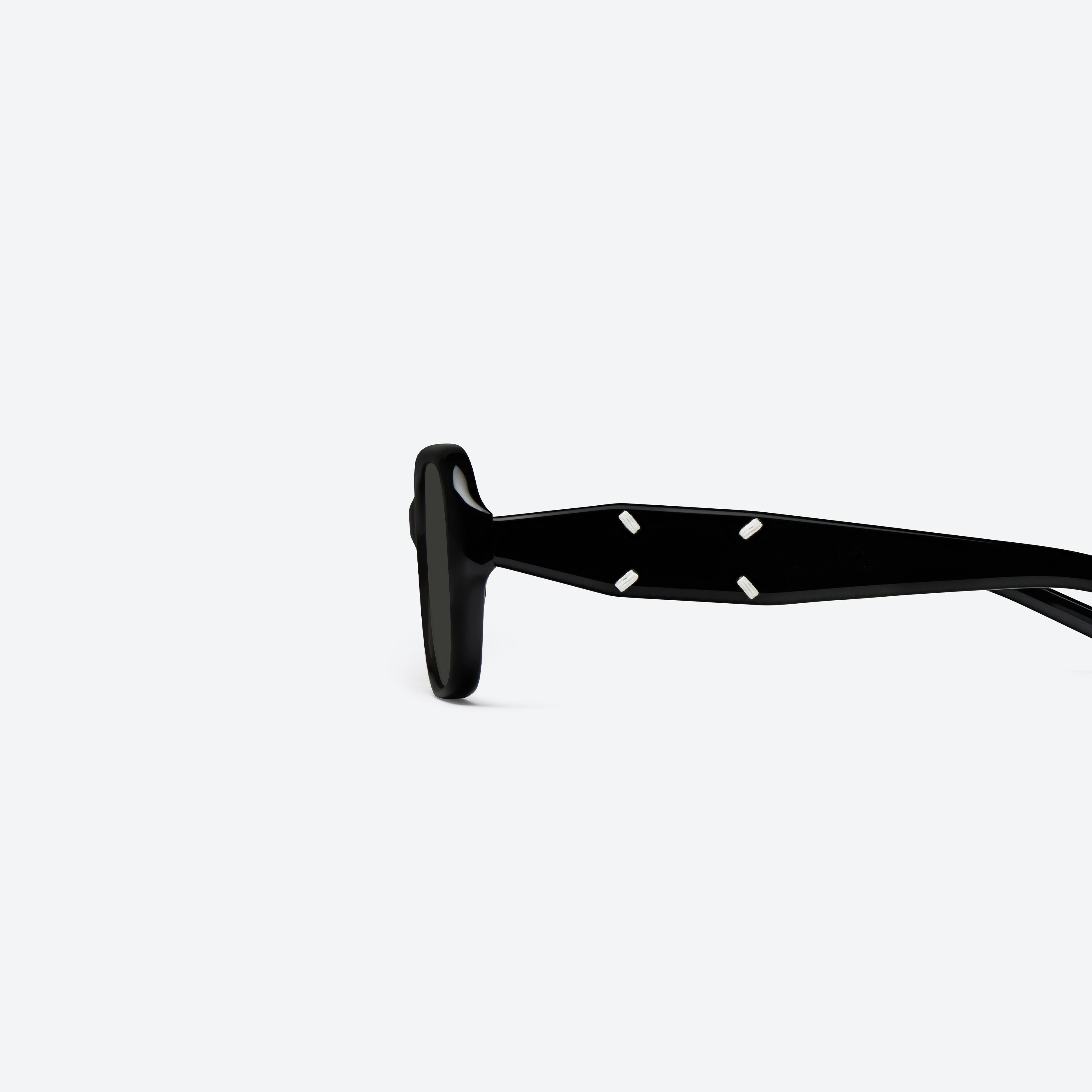 A detailed left view of Gentle Monster Maison Margiela - MM306 01(G) Black Acetate framed Square sunglasses.