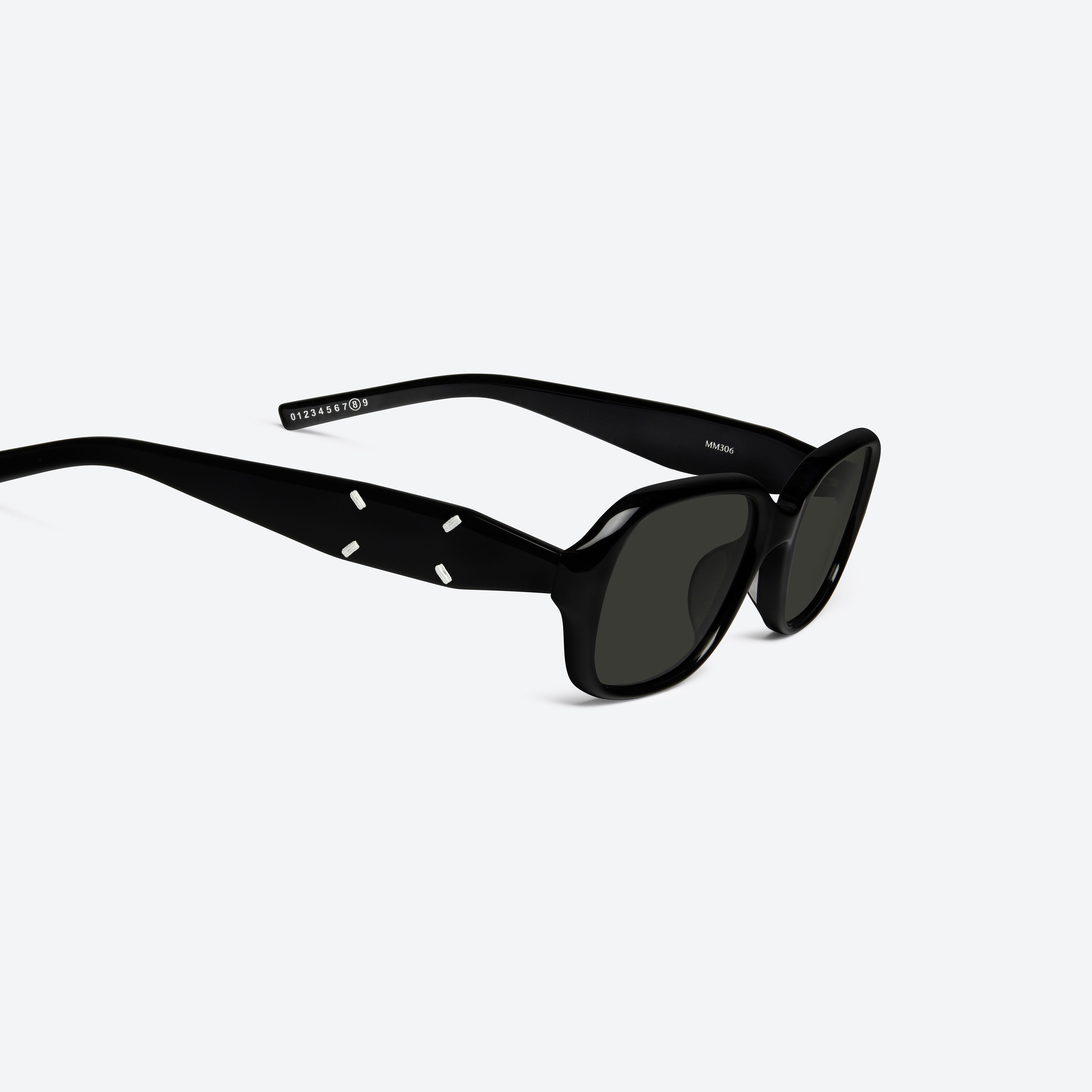 45-degree detailed view of Gentle Monster Maison Margiela - MM306 01(G) Black Acetate framed Square sunglasses.