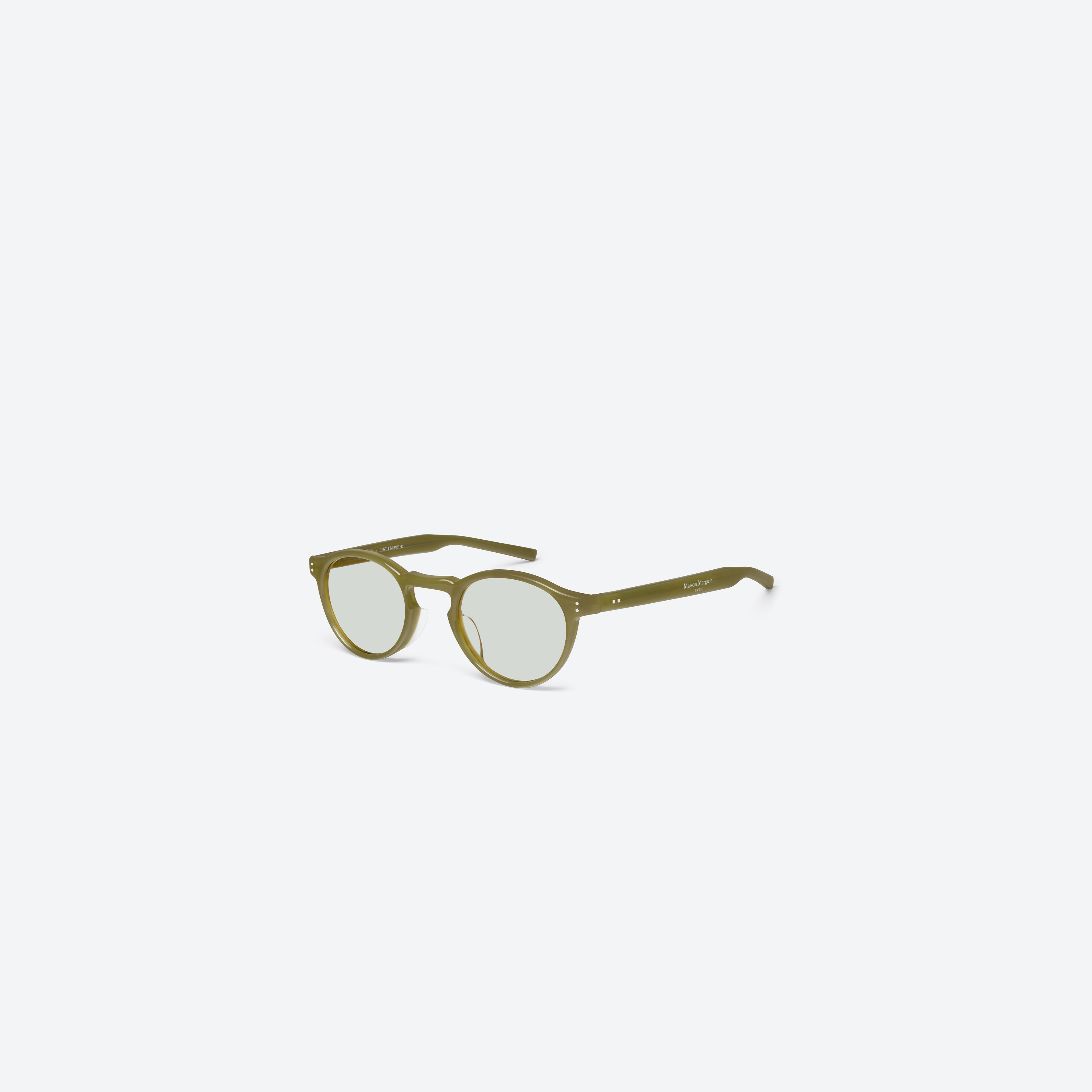 45-degree view of Gentle Monster Maison Margiela - MM309 GRC7 Green Acetate framed Round sunglasses.