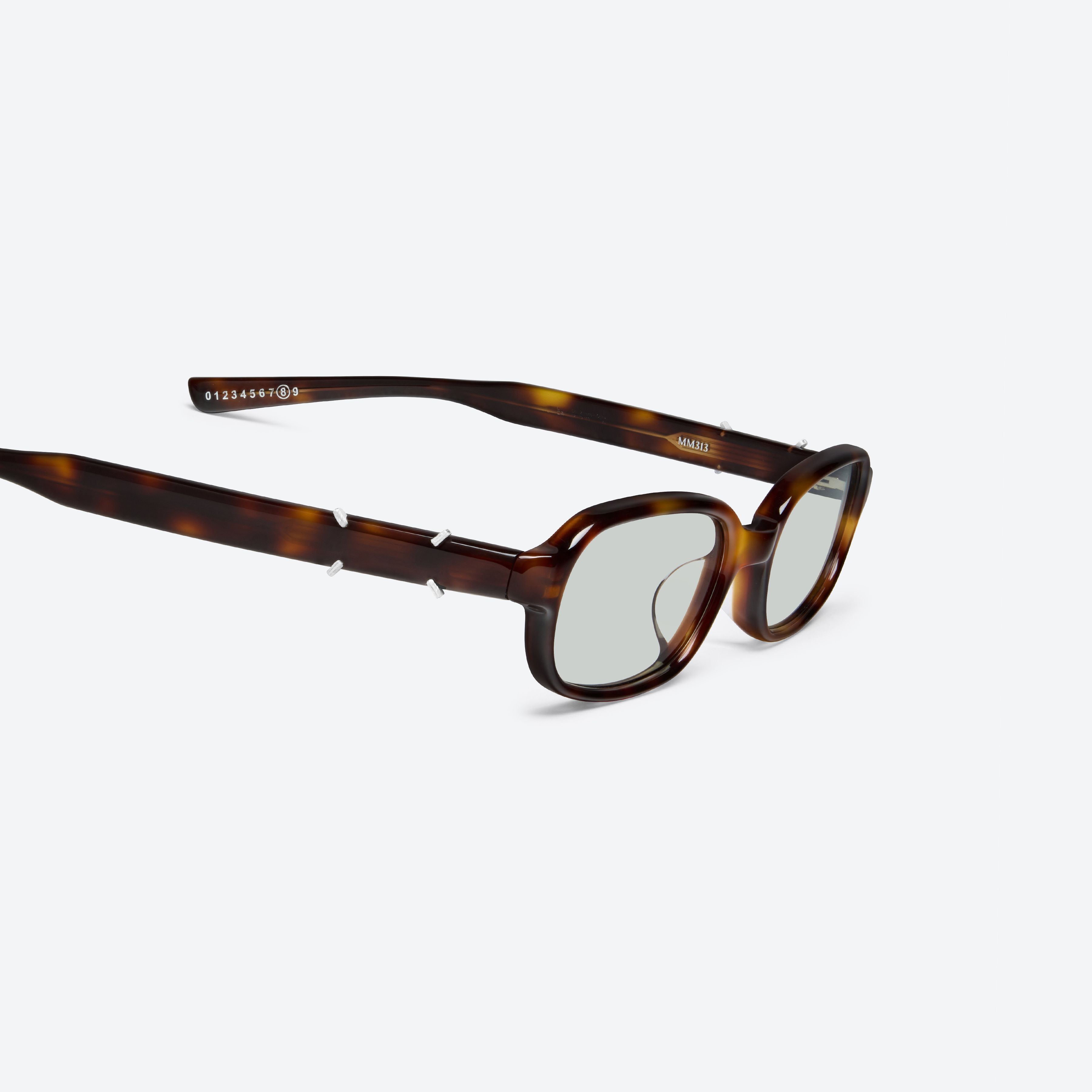 45-degree detailed view of Gentle Monster Maison Margiela - MM313 L2 Tortoise Acetate framed Square sunglasses.