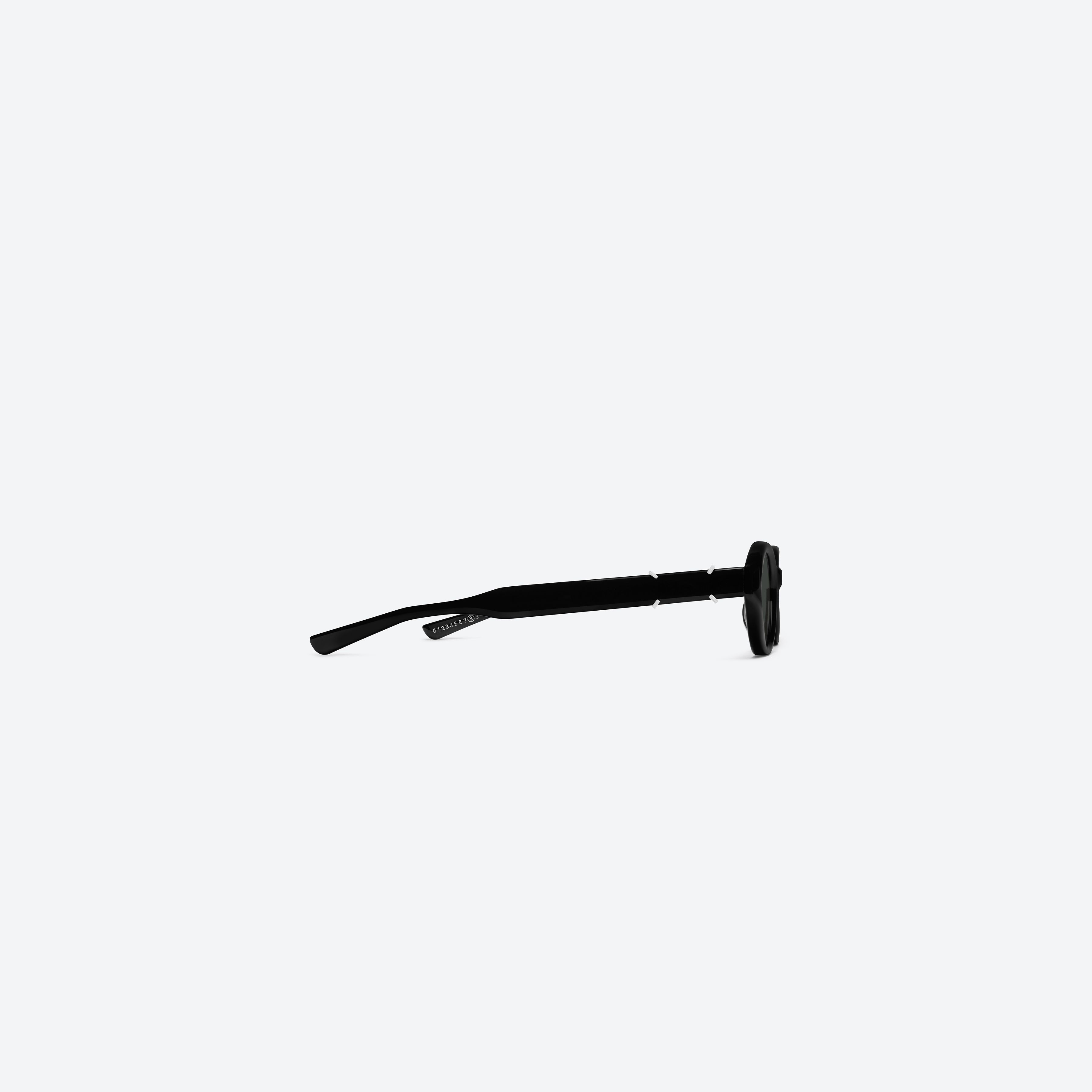 A detailed right view of Gentle Monster Maison Margiela - MM315 01 Black Acetate framed Oval sunglasses.