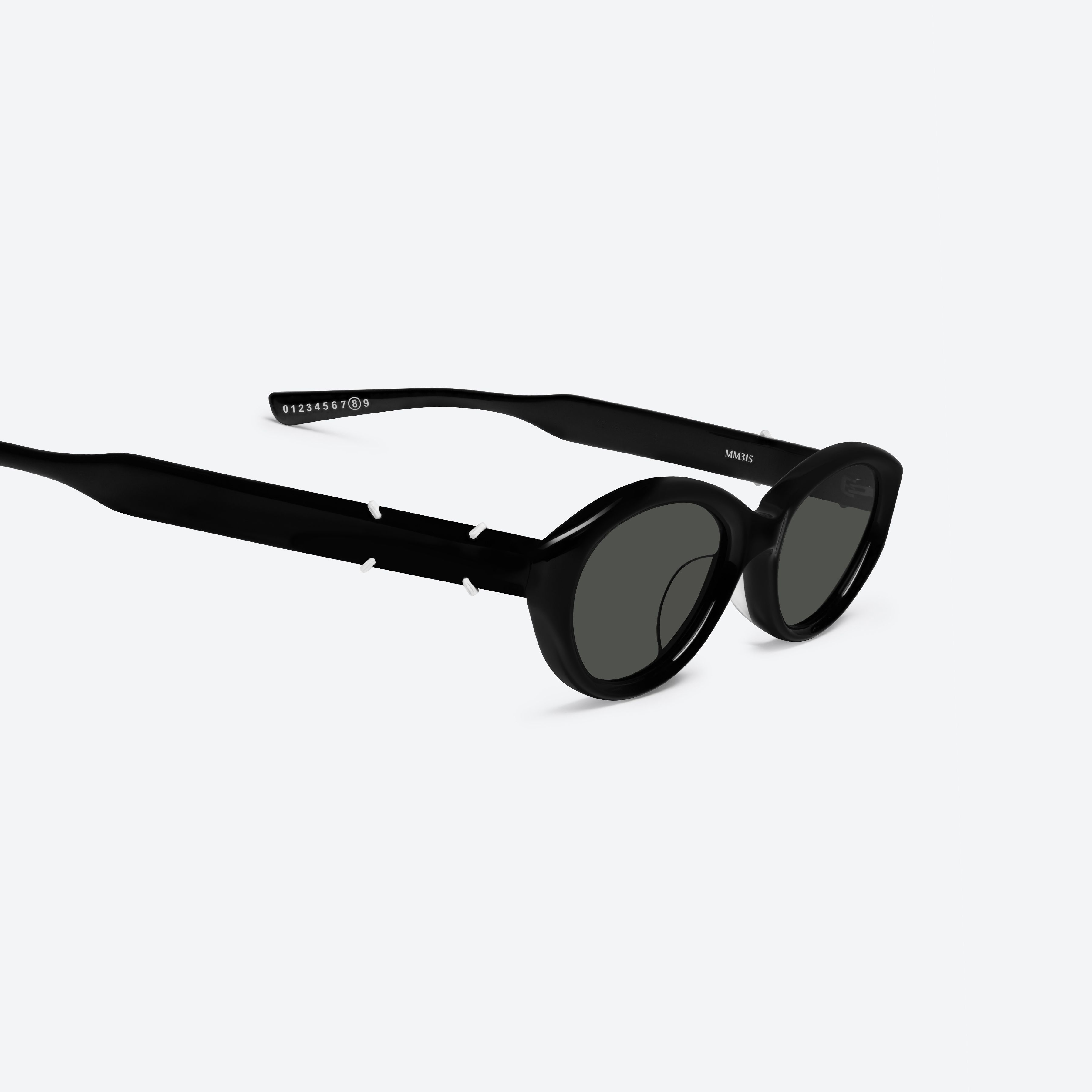 45-degree detailed view of Gentle Monster Maison Margiela - MM315 01 Black Acetate framed Oval sunglasses.