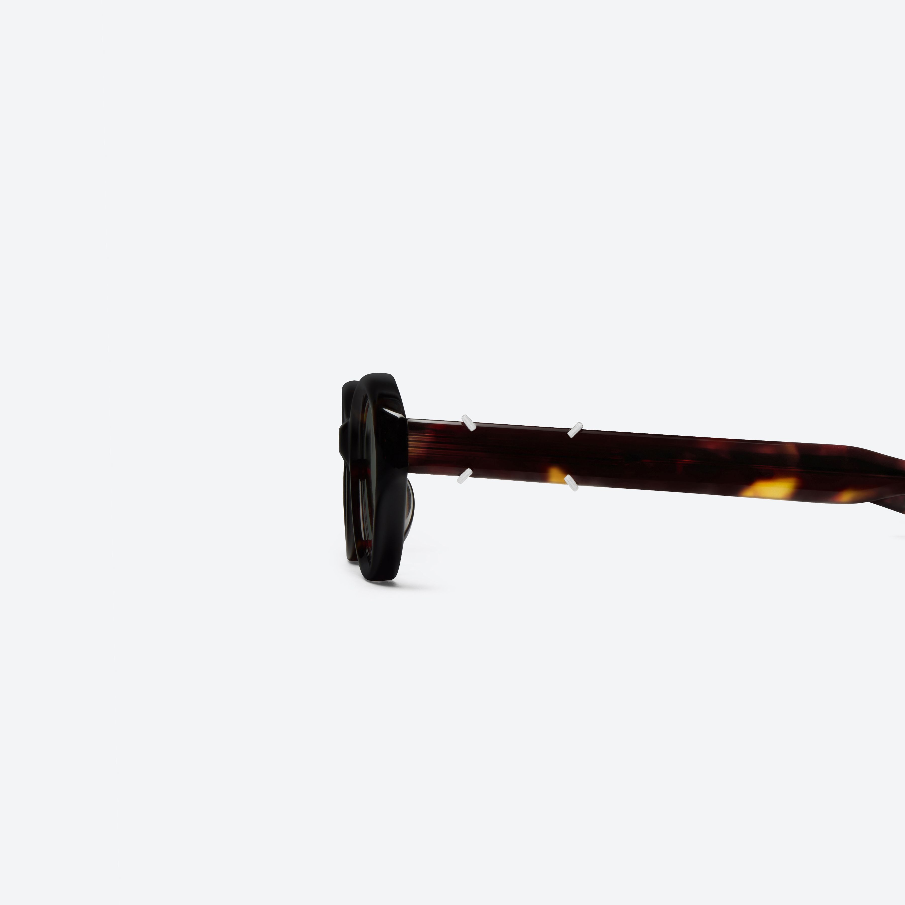 A detailed left view of Gentle Monster Maison Margiela - MM315 T1 Tortoise Acetate framed Oval sunglasses.