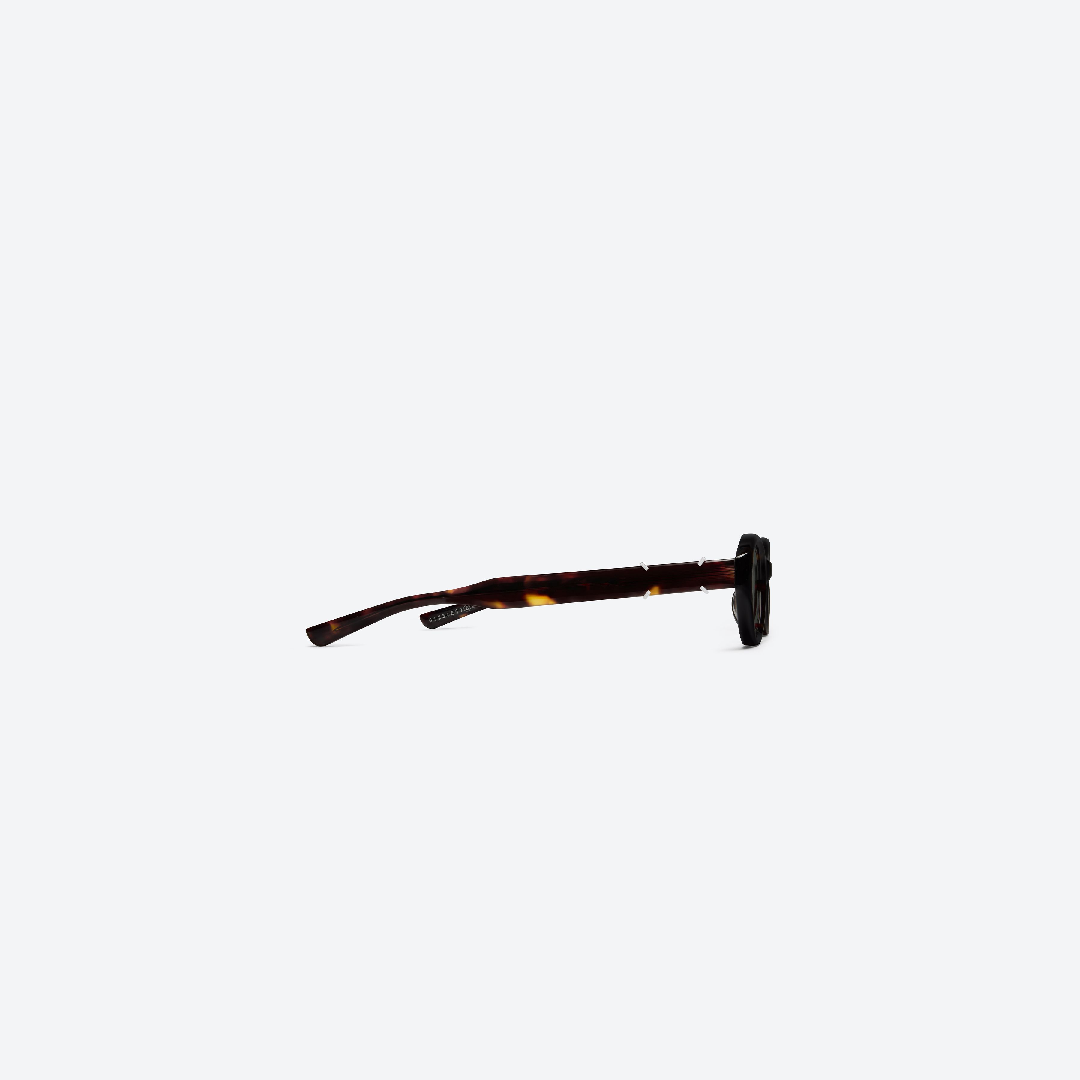 A detailed right view of Gentle Monster Maison Margiela - MM315 T1 Tortoise Acetate framed Oval sunglasses.
