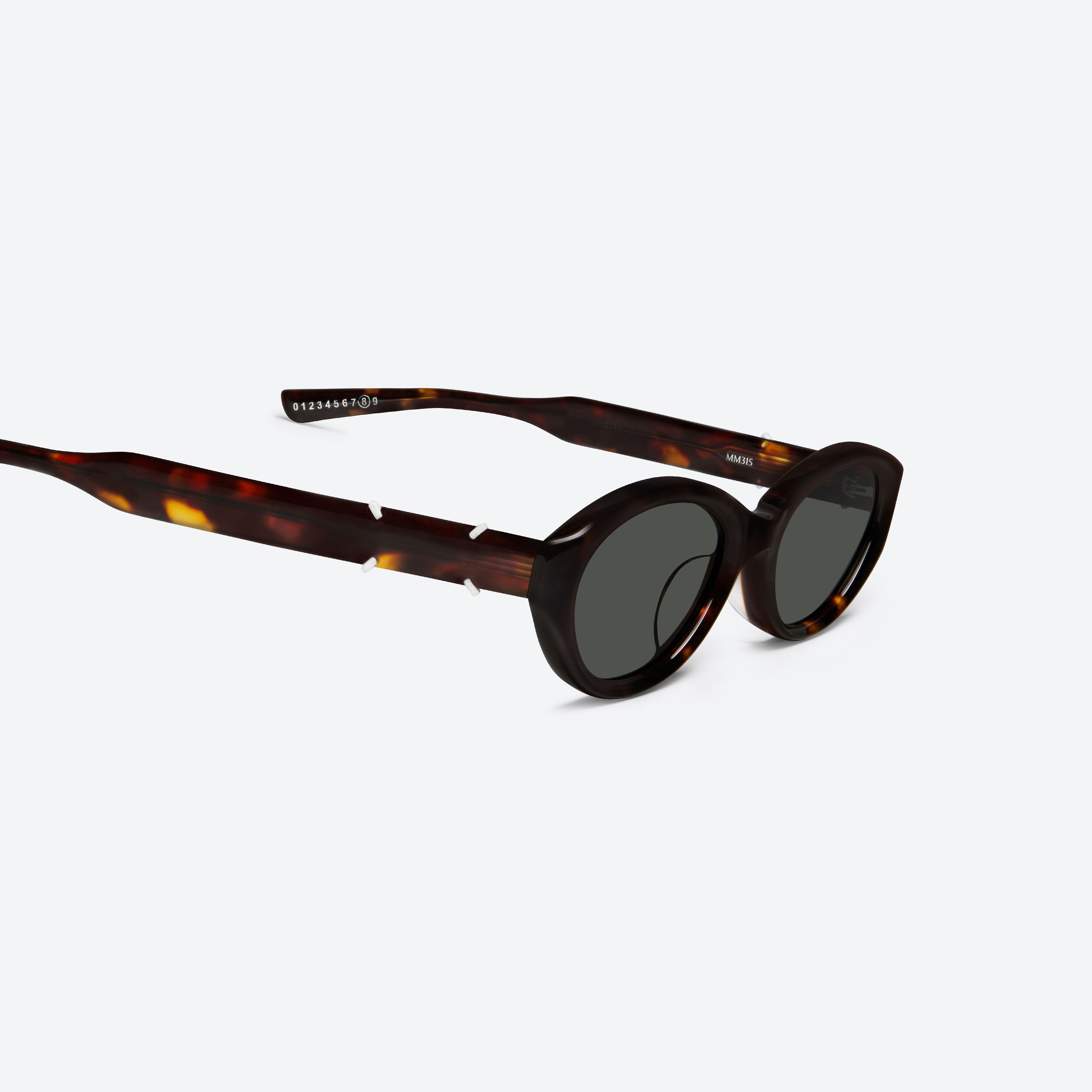45-degree detailed view of Gentle Monster Maison Margiela - MM315 T1 Tortoise Acetate framed Oval sunglasses.