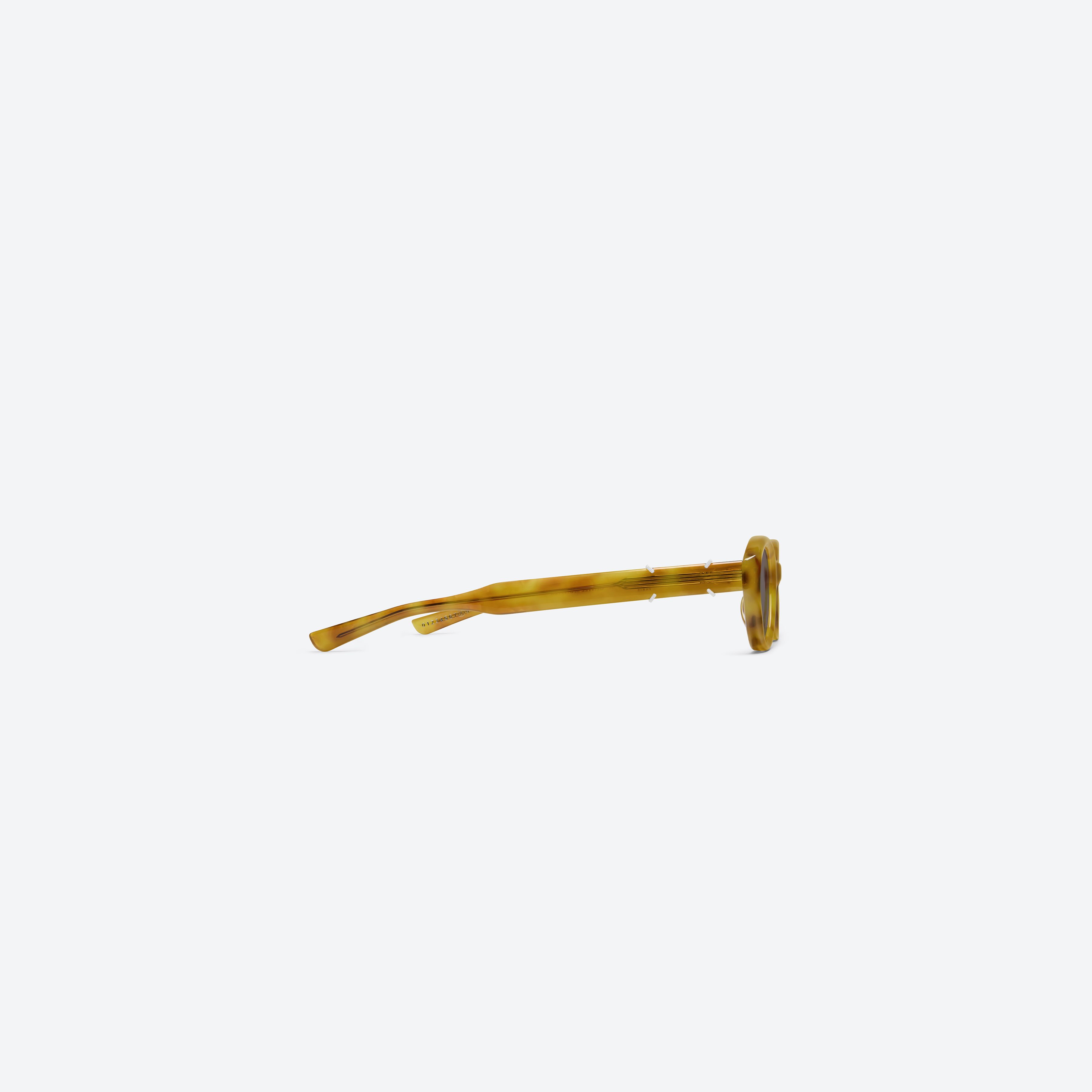 A detailed right view of Gentle Monster Maison Margiela - MM315 T12 Tortoise Acetate framed Oval sunglasses.