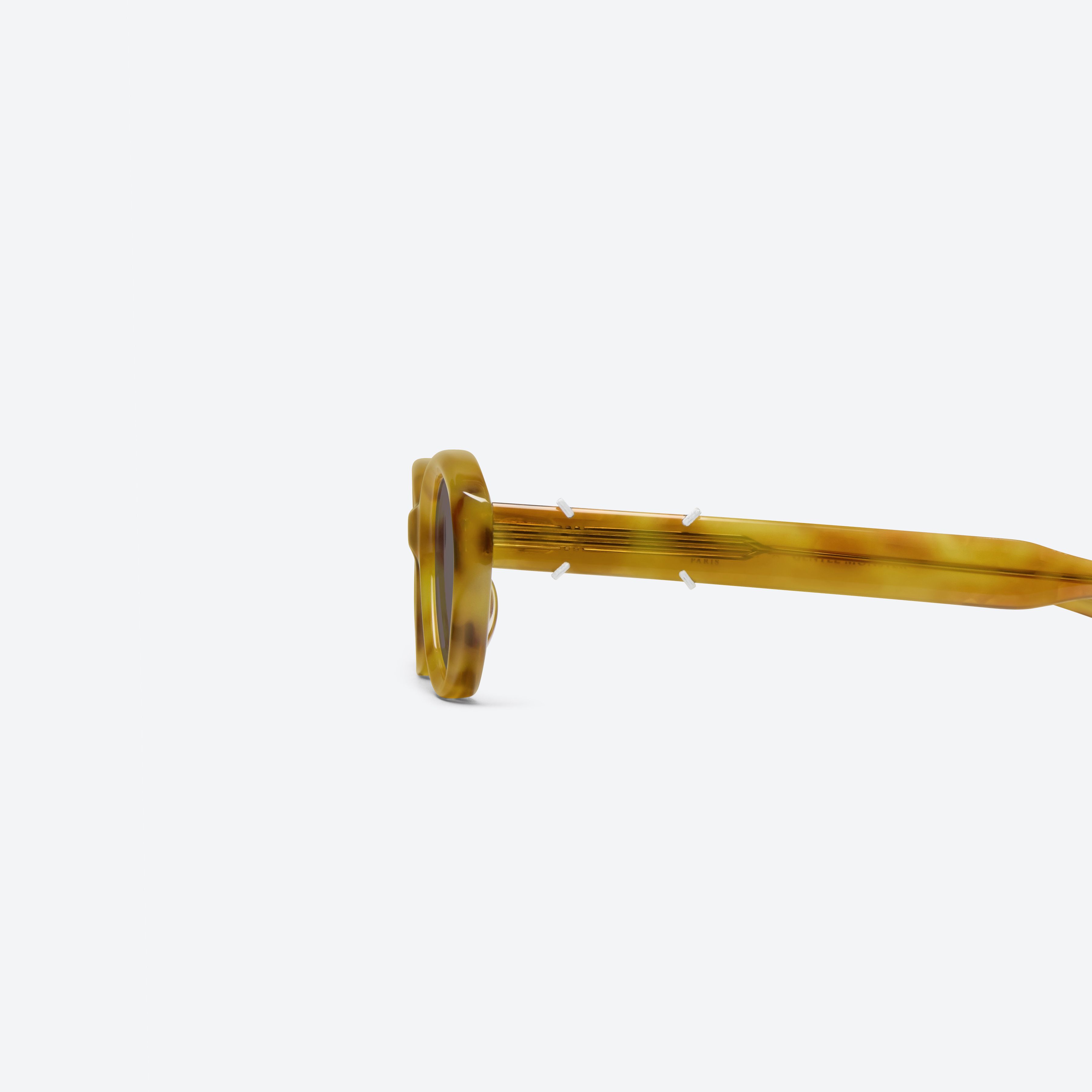 A detailed left view of Gentle Monster Maison Margiela - MM315 T12 Tortoise Acetate framed Oval sunglasses.