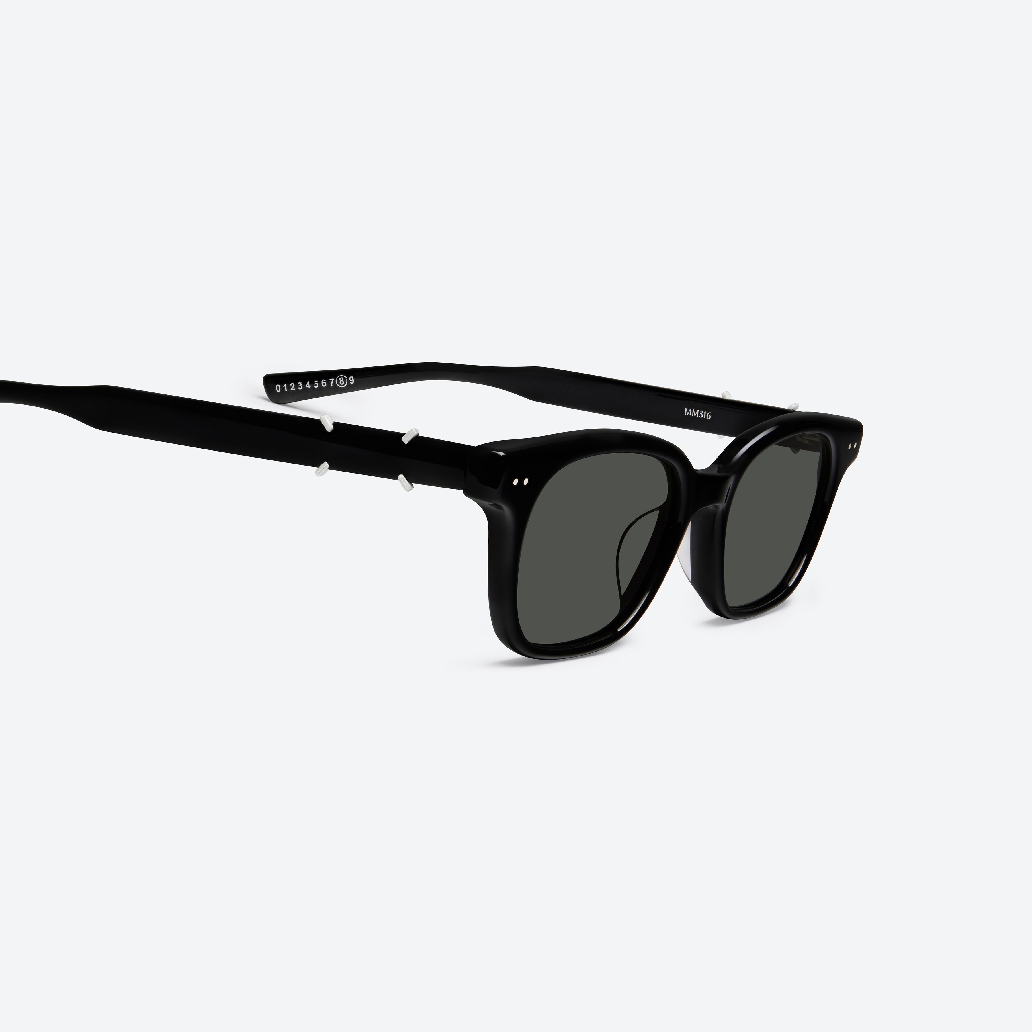 45-degree detailed view of Gentle Monster Maison Margiela - MM316 01 Black Acetate framed Square sunglasses.