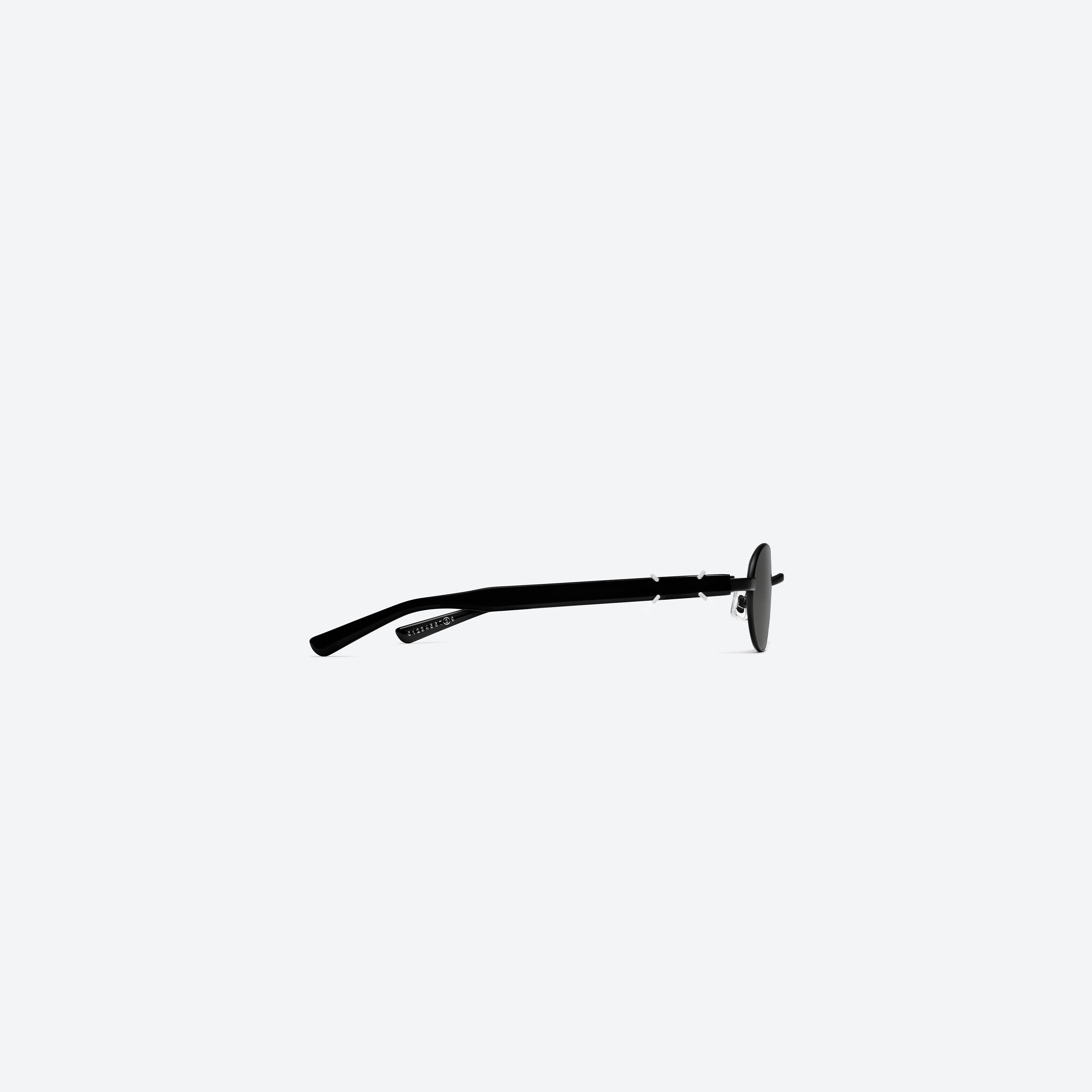 A detailed right view of Gentle Monster Maison Margiela - MM310 M01 Black Mixed framed Oval sunglasses.