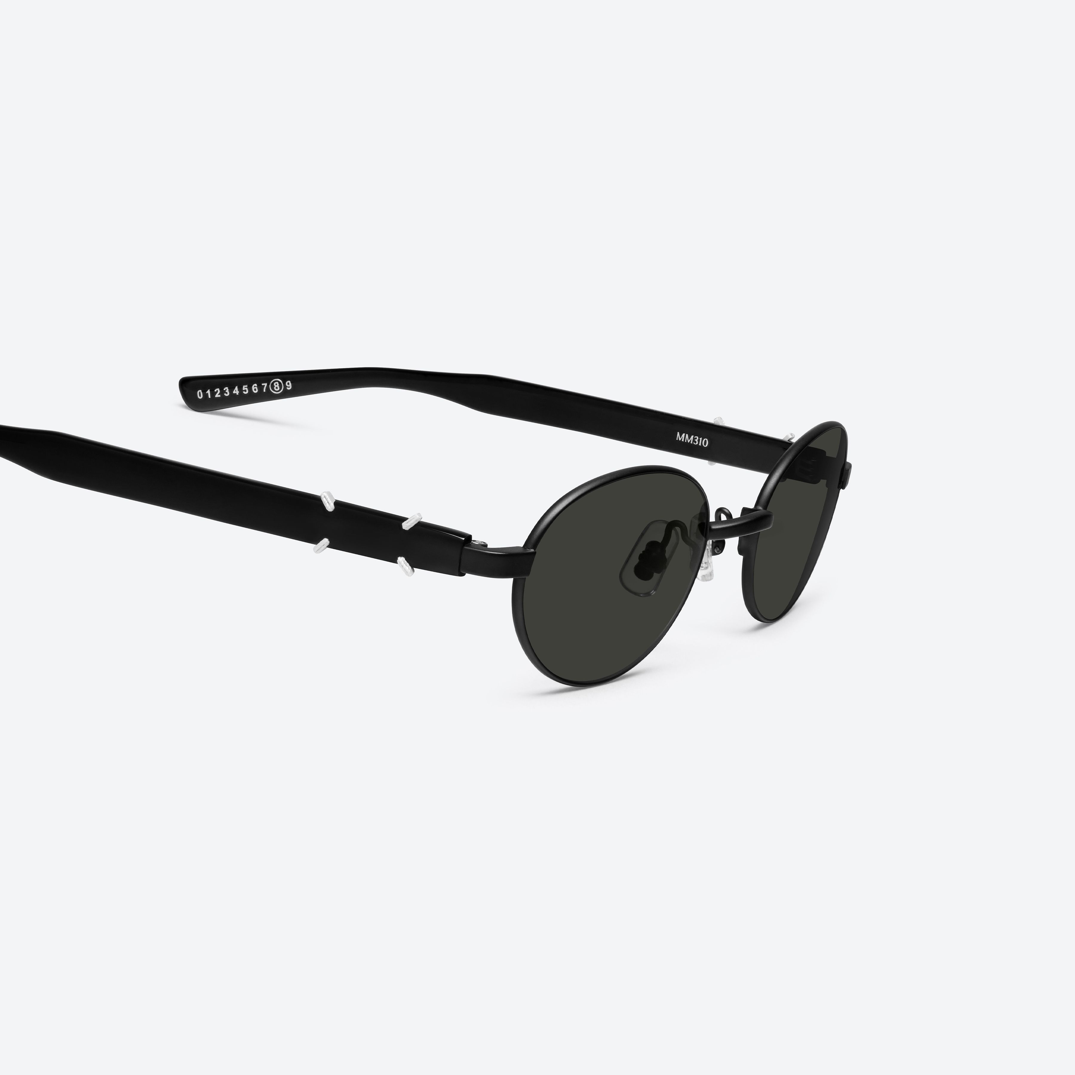 45-degree detailed view of Gentle Monster Maison Margiela - MM310 M01 Black Mixed framed Oval sunglasses.