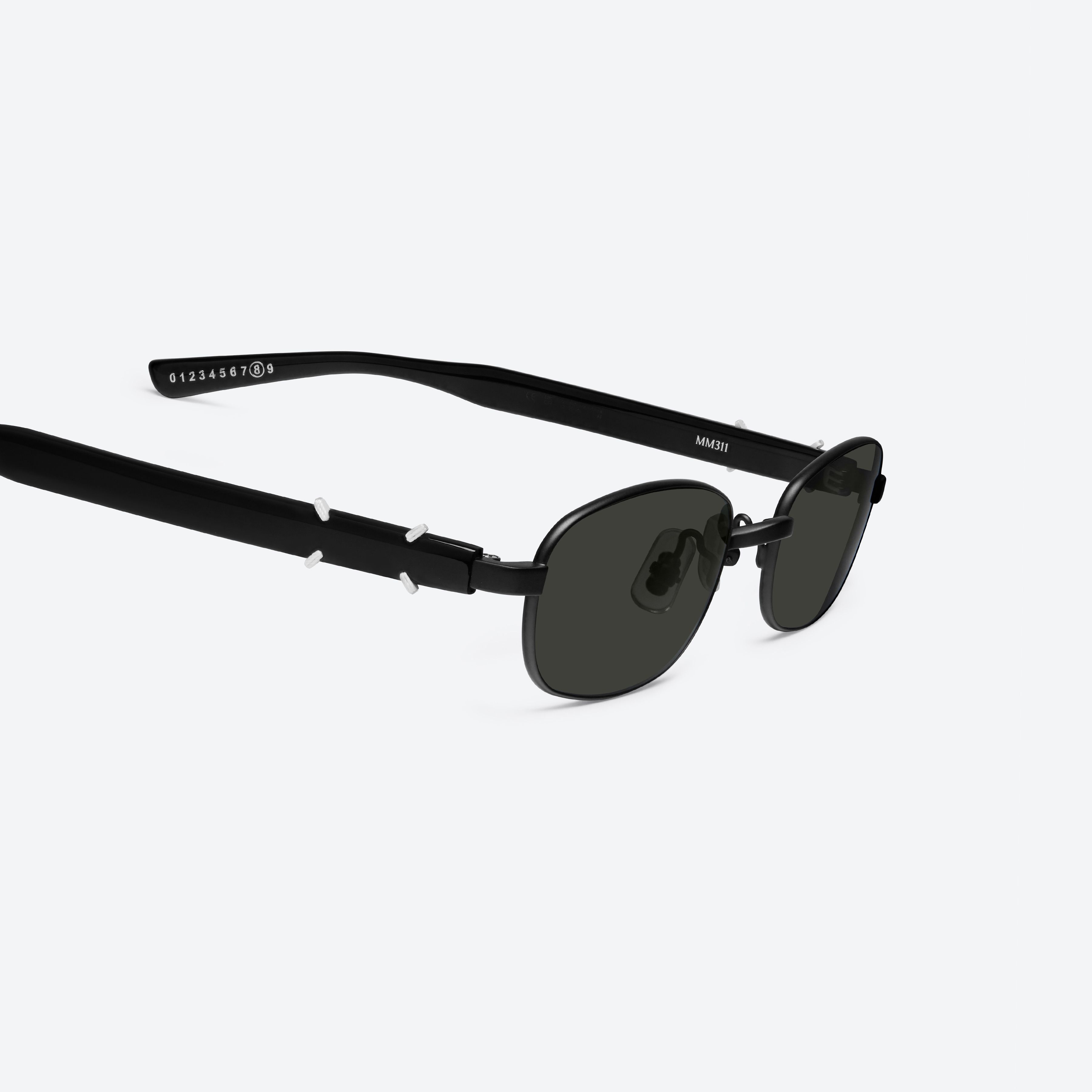 45-degree detailed view of Gentle Monster Maison Margiela - MM311 M01 Black Mixed framed Square sunglasses.