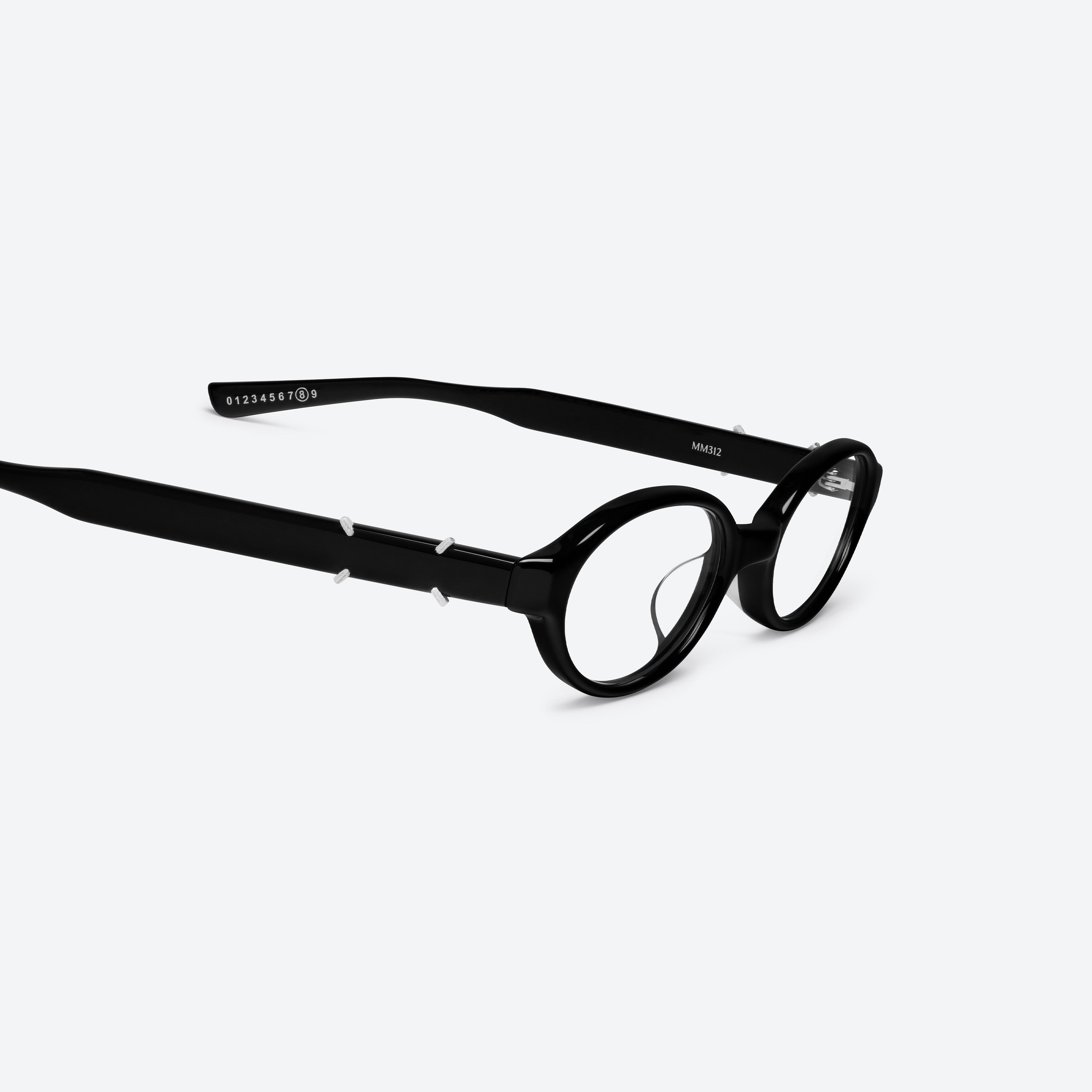 45-degree detailed view of Gentle Monster Maison Margiela - MM312 01 Black Acetate framed Oval glasses.