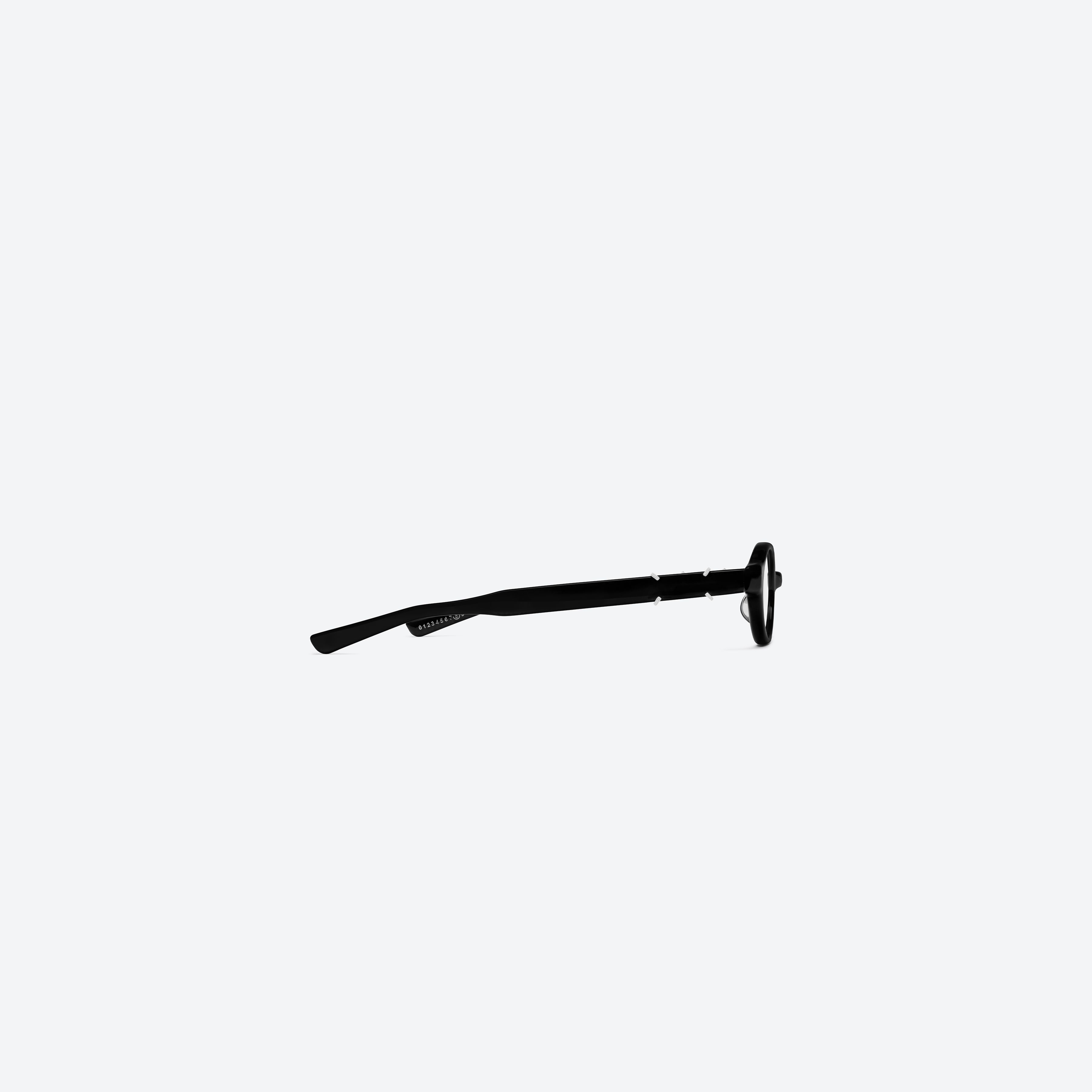 A detailed right view of Gentle Monster Maison Margiela - MM312 01 Black Acetate framed Oval glasses.