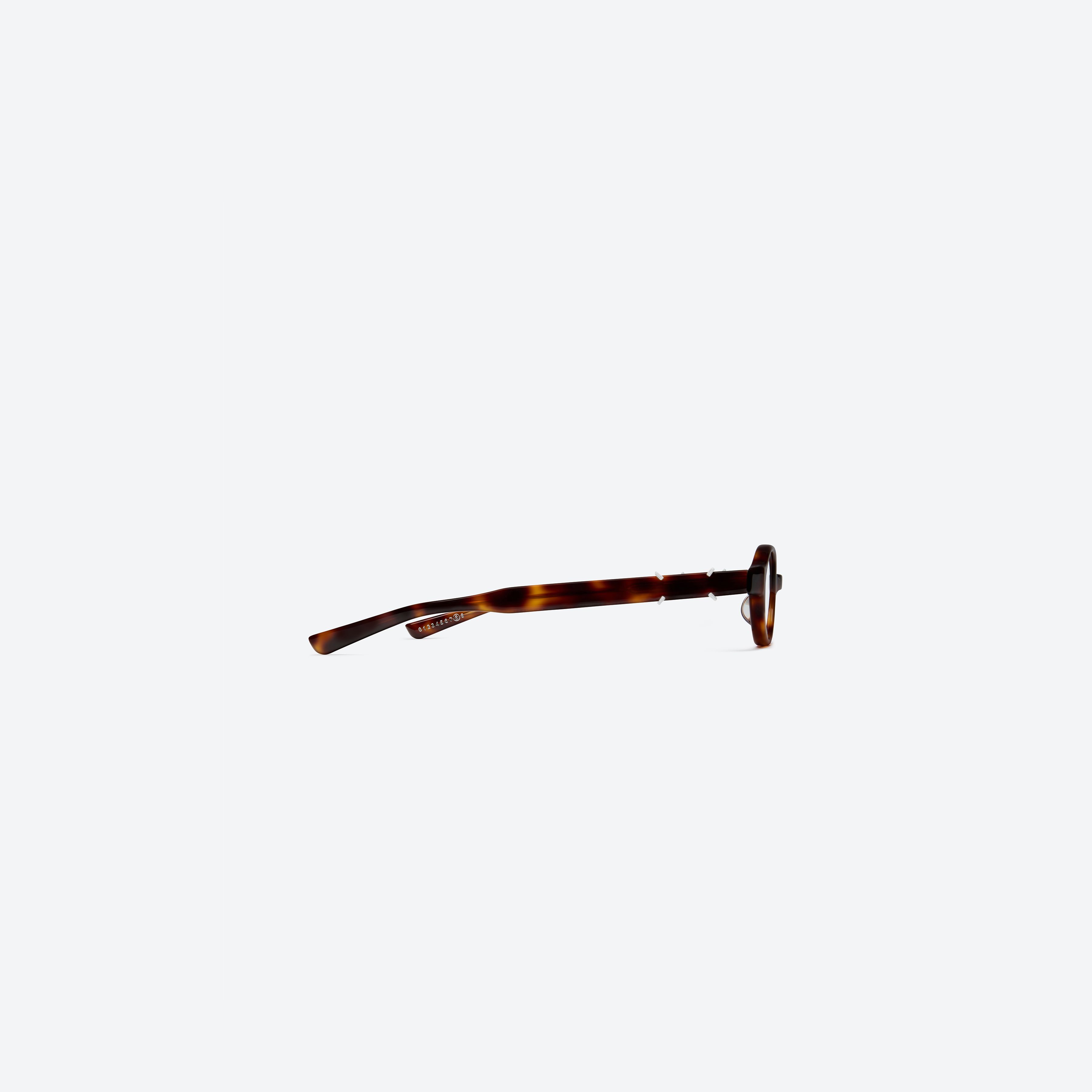 A detailed right view of Gentle Monster Maison Margiela - MM312 L2 Tortoise Acetate framed Oval glasses.