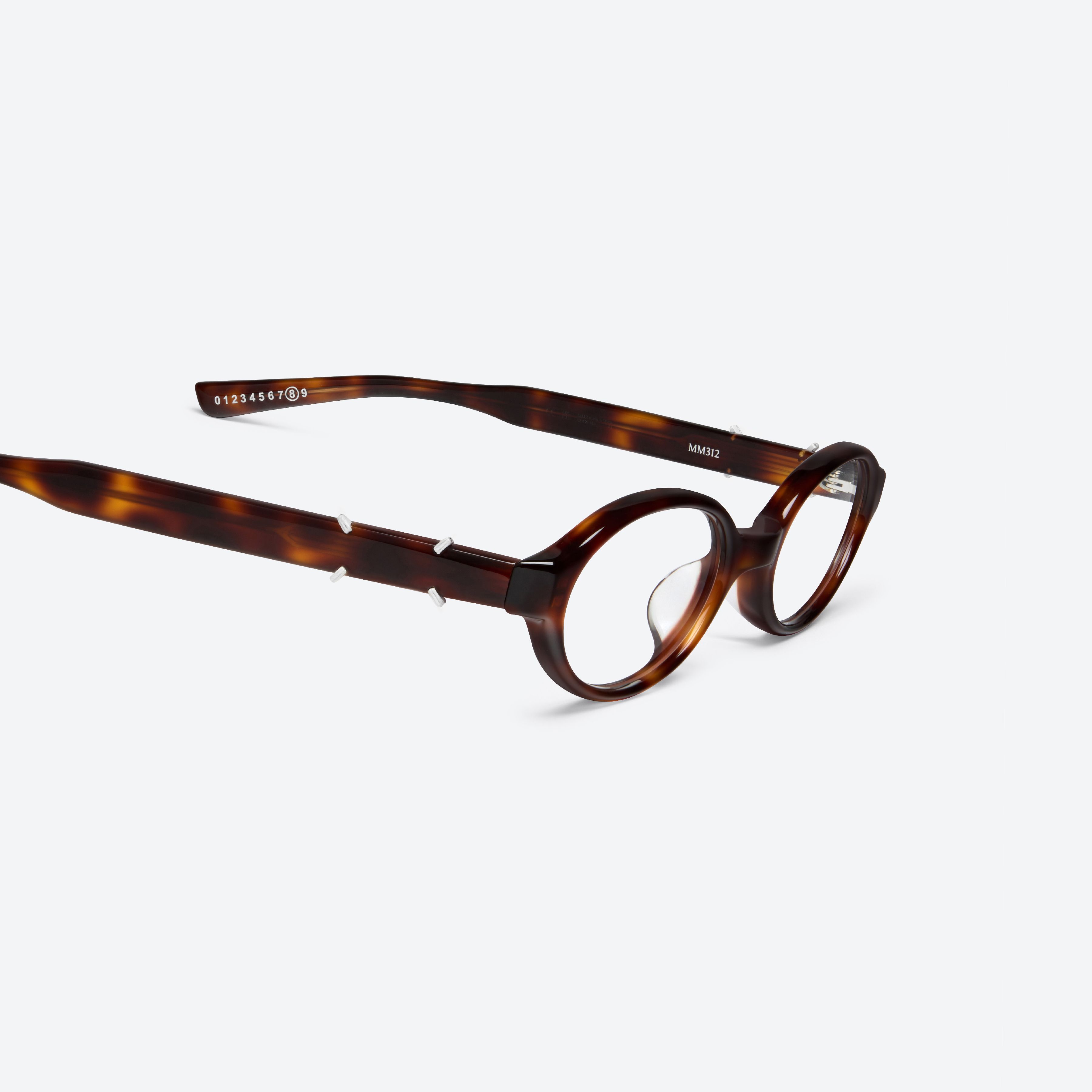 45-degree detailed view of Gentle Monster Maison Margiela - MM312 L2 Tortoise Acetate framed Oval glasses.