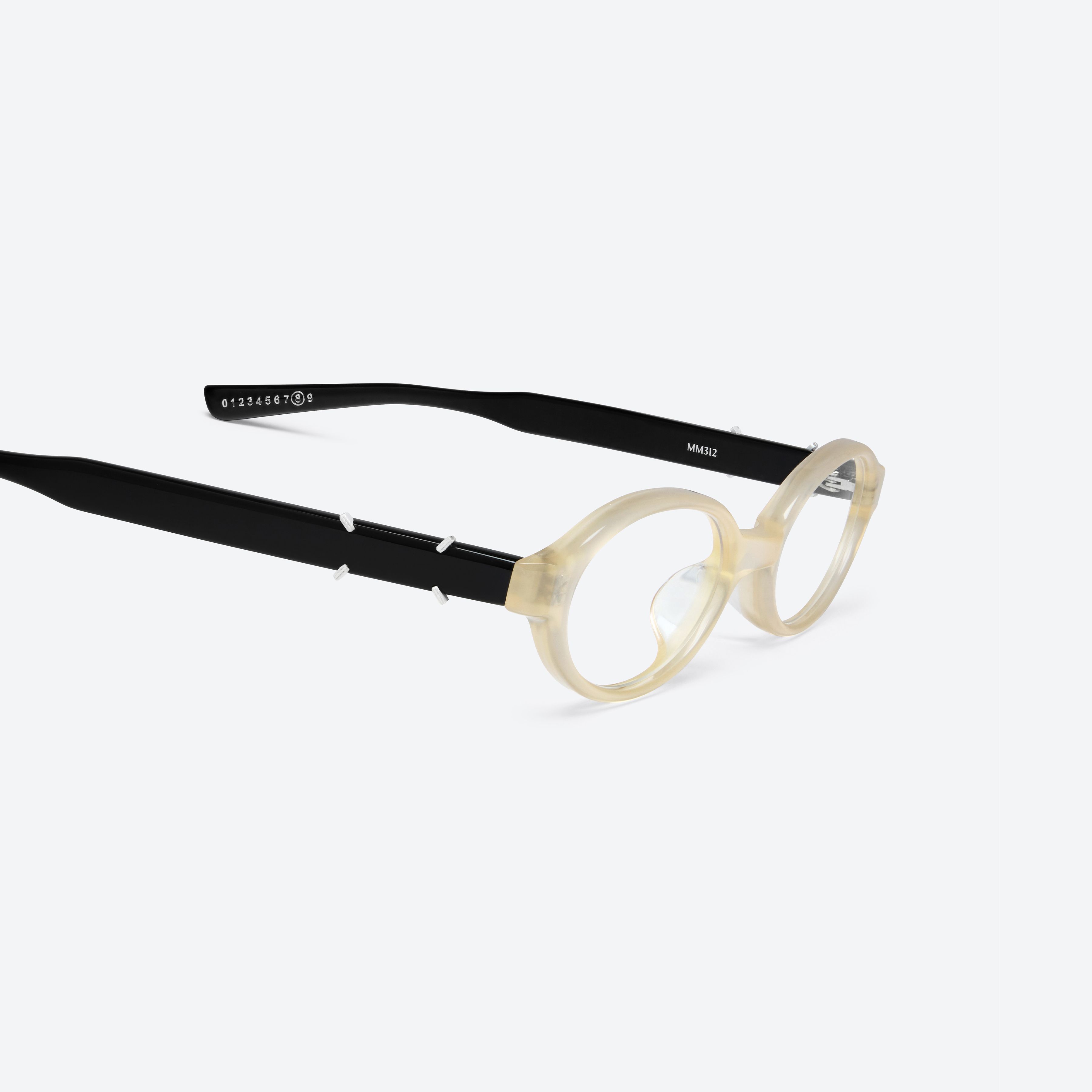 45-degree detailed view of Gentle Monster Maison Margiela - MM312 IC4 Ivory Acetate framed Oval glasses.
