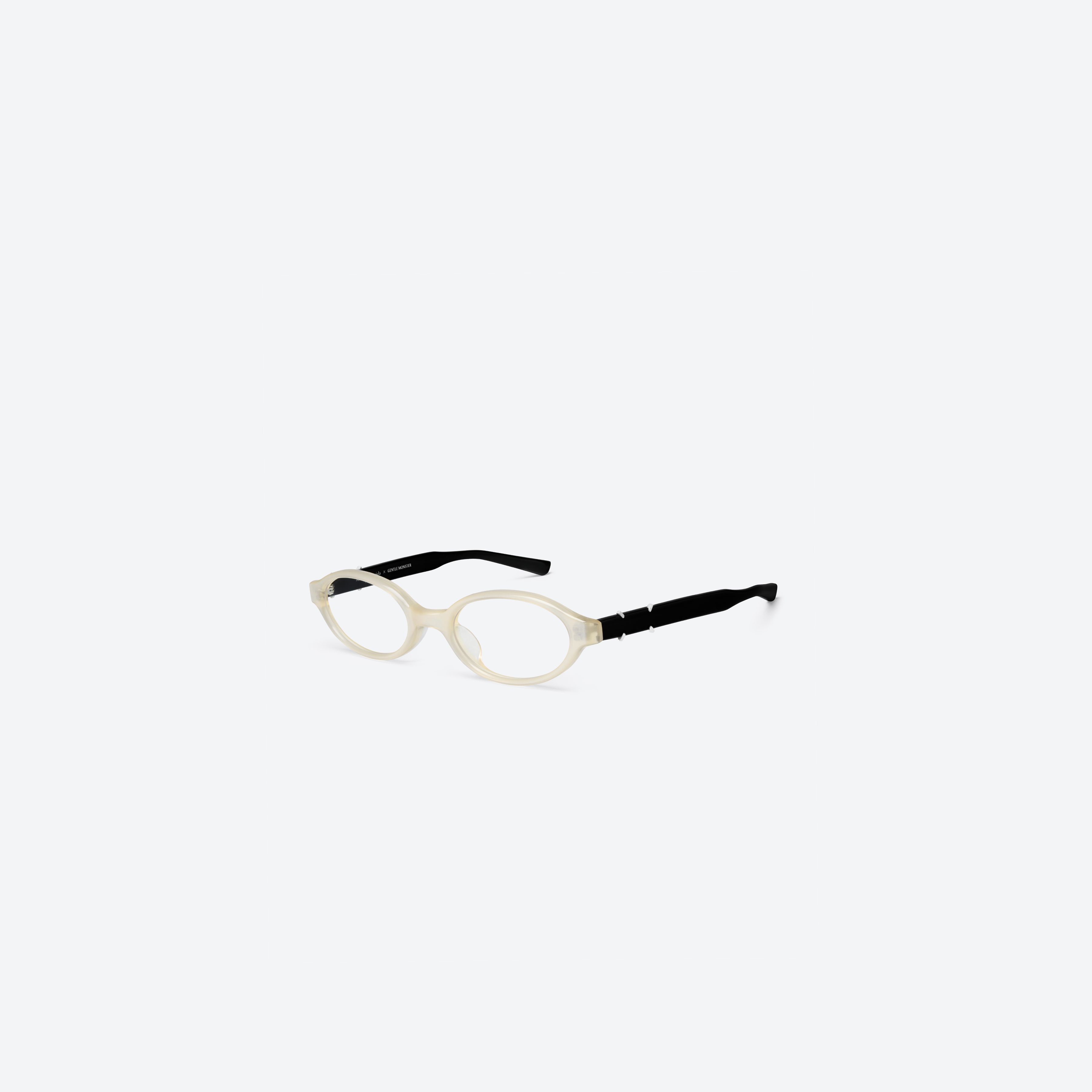 45-degree view of Gentle Monster Maison Margiela - MM312 IC4 Ivory Acetate framed Oval glasses.