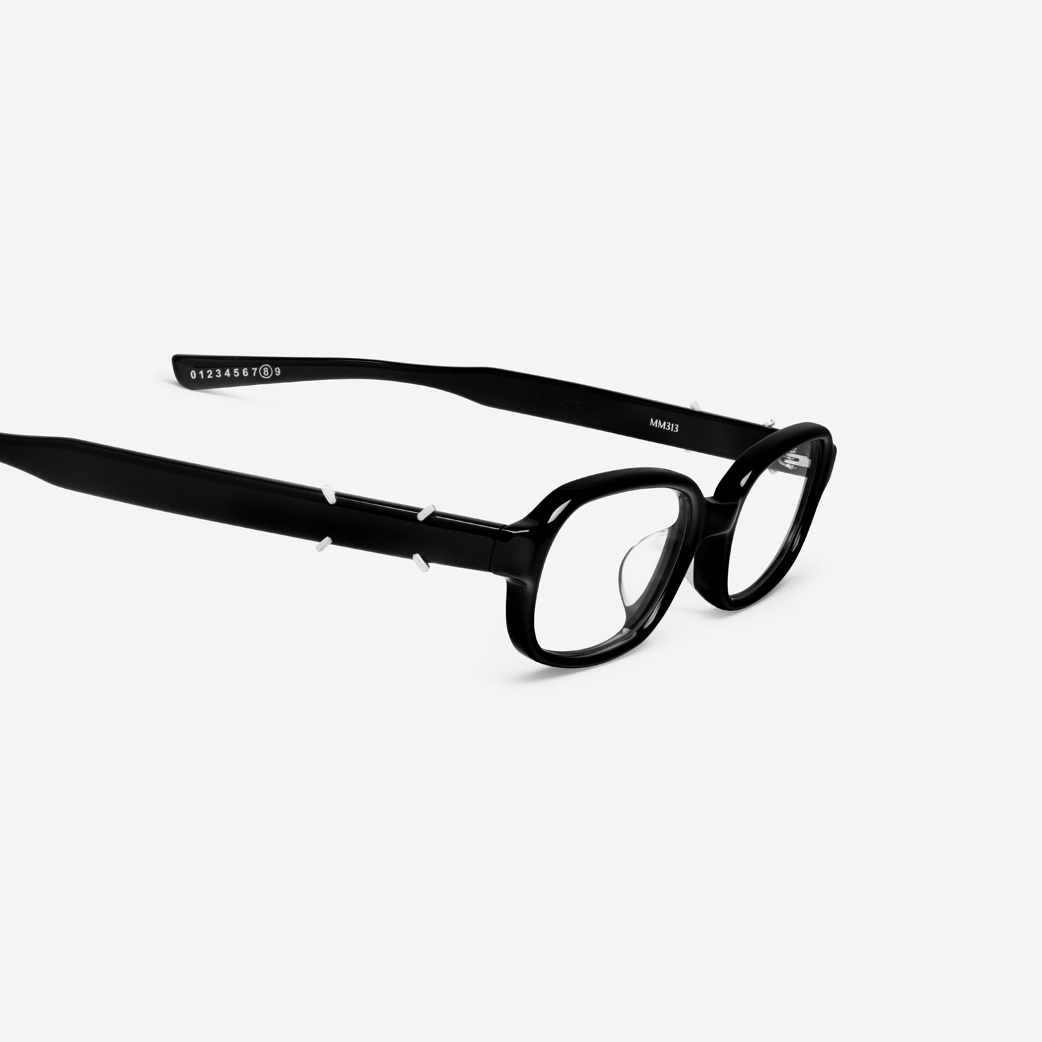 45-degree detailed view of Gentle Monster Maison Margiela - MM313 01 Black Acetate framed Square glasses.