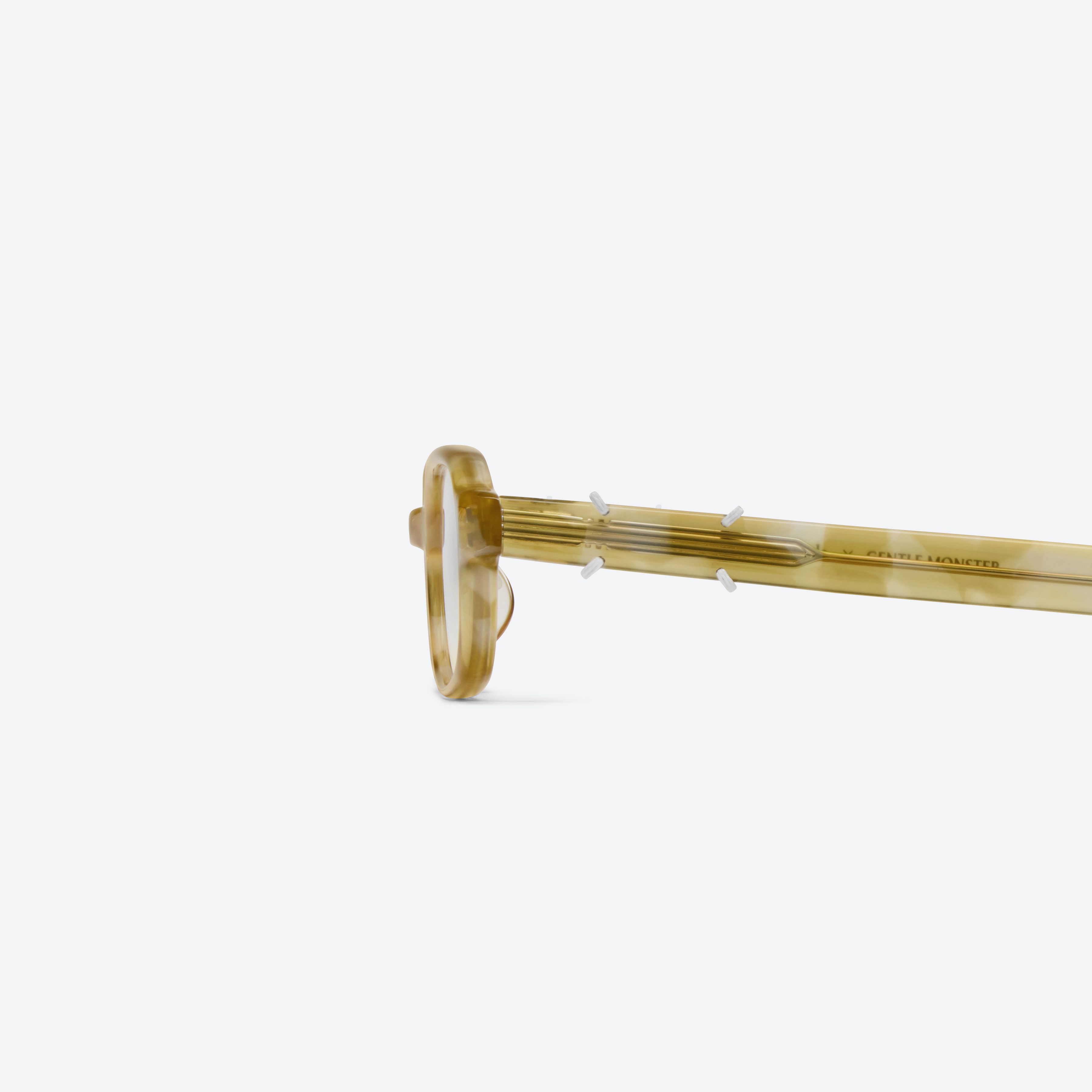 A detailed left view of Gentle Monster Maison Margiela - MM313 T13 Tortoise Acetate framed Square glasses.