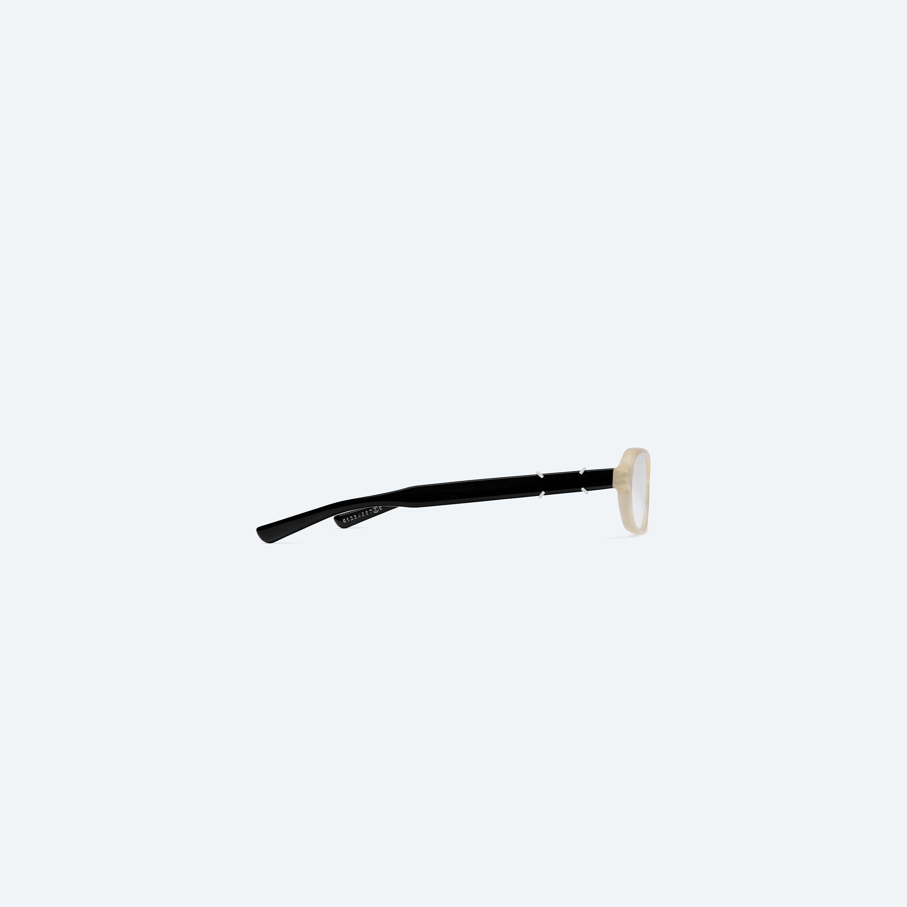 A detailed right view of Gentle Monster Maison Margiela - MM314 IC4 Ivory Acetate framed Aviator glasses.