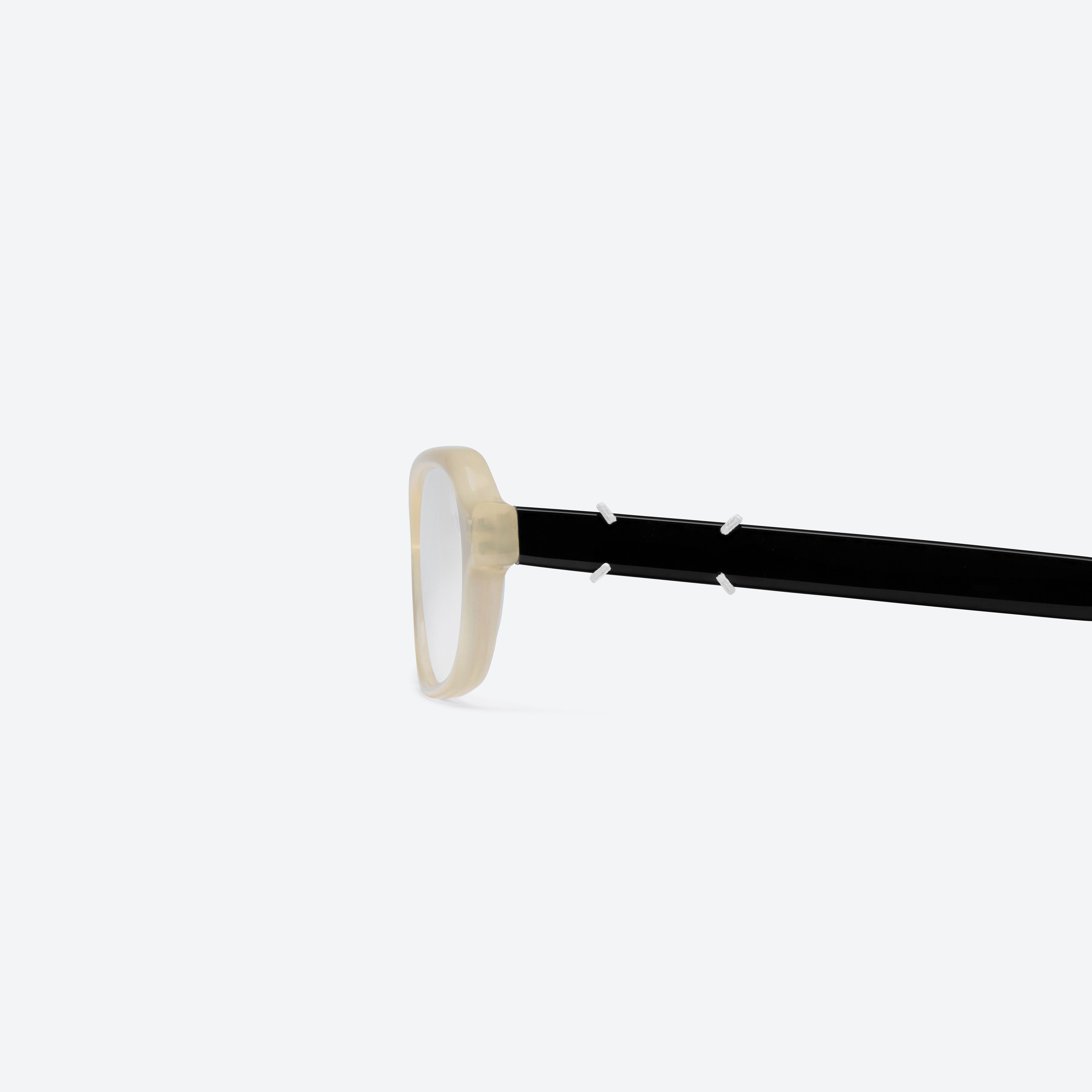 A detailed left view of Gentle Monster Maison Margiela - MM314 IC4 Ivory Acetate framed Aviator glasses.