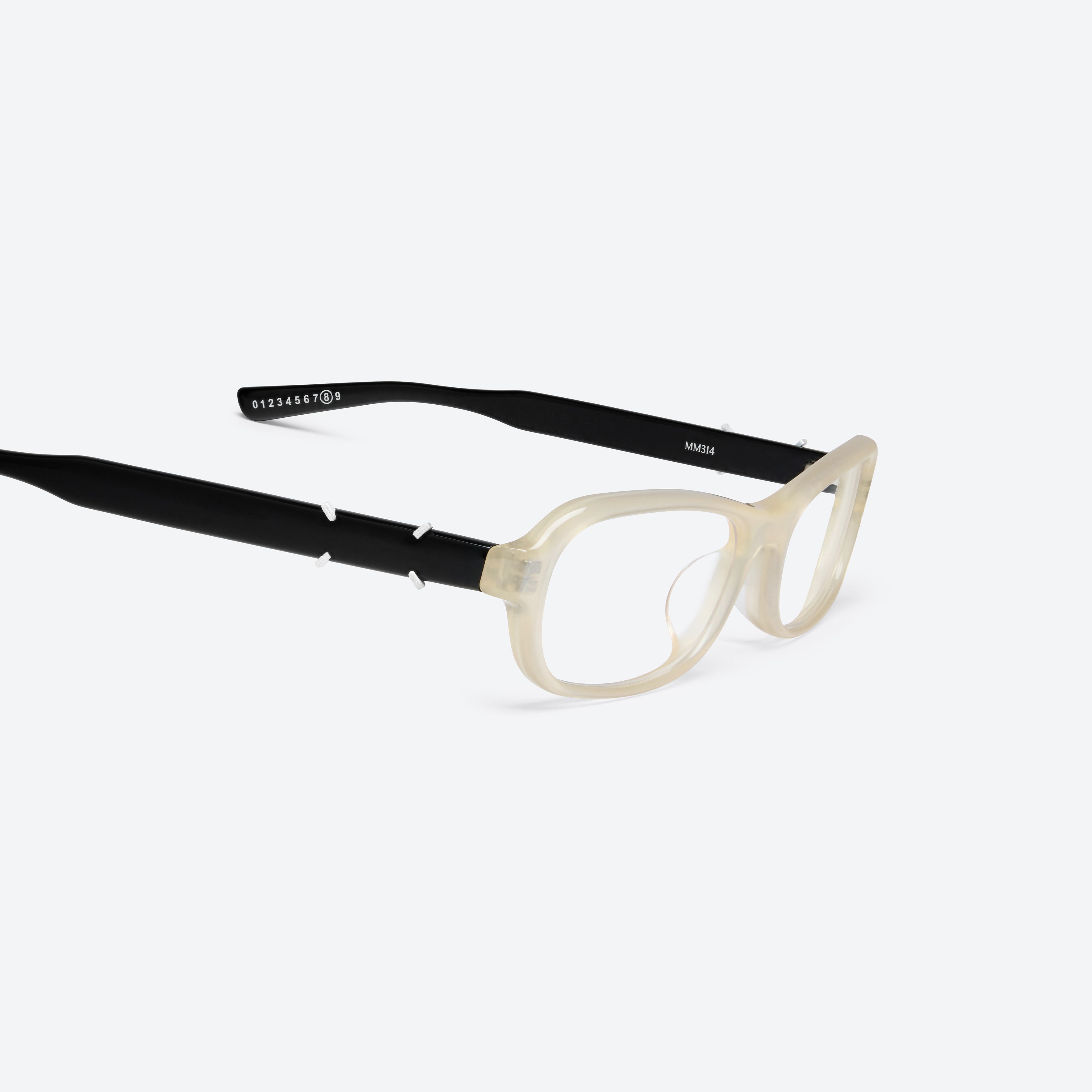 45-degree detailed view of Gentle Monster Maison Margiela - MM314 IC4 Ivory Acetate framed Aviator glasses.