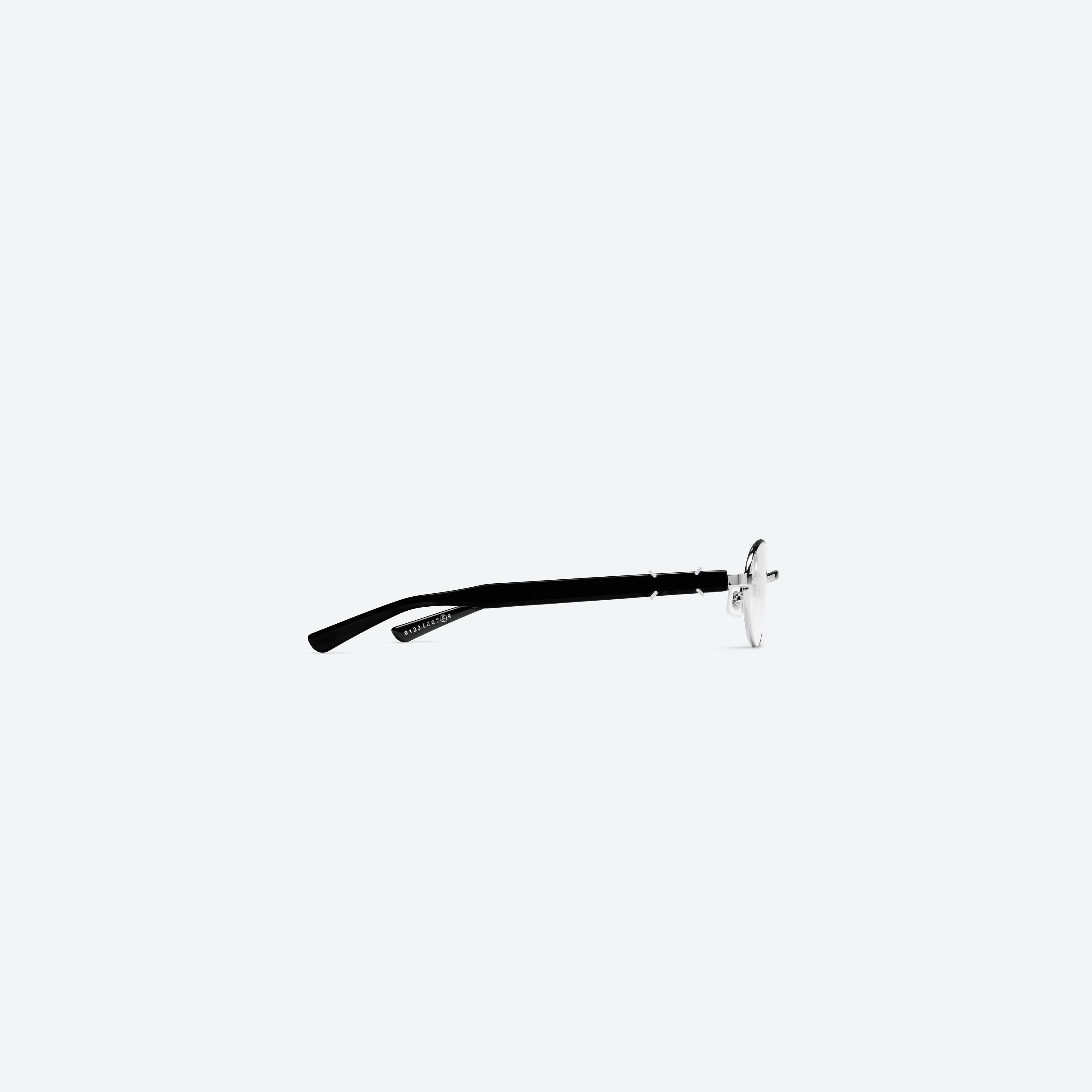 A detailed right view of Gentle Monster Maison Margiela - MM310 02 Silver Mixed framed Oval glasses.