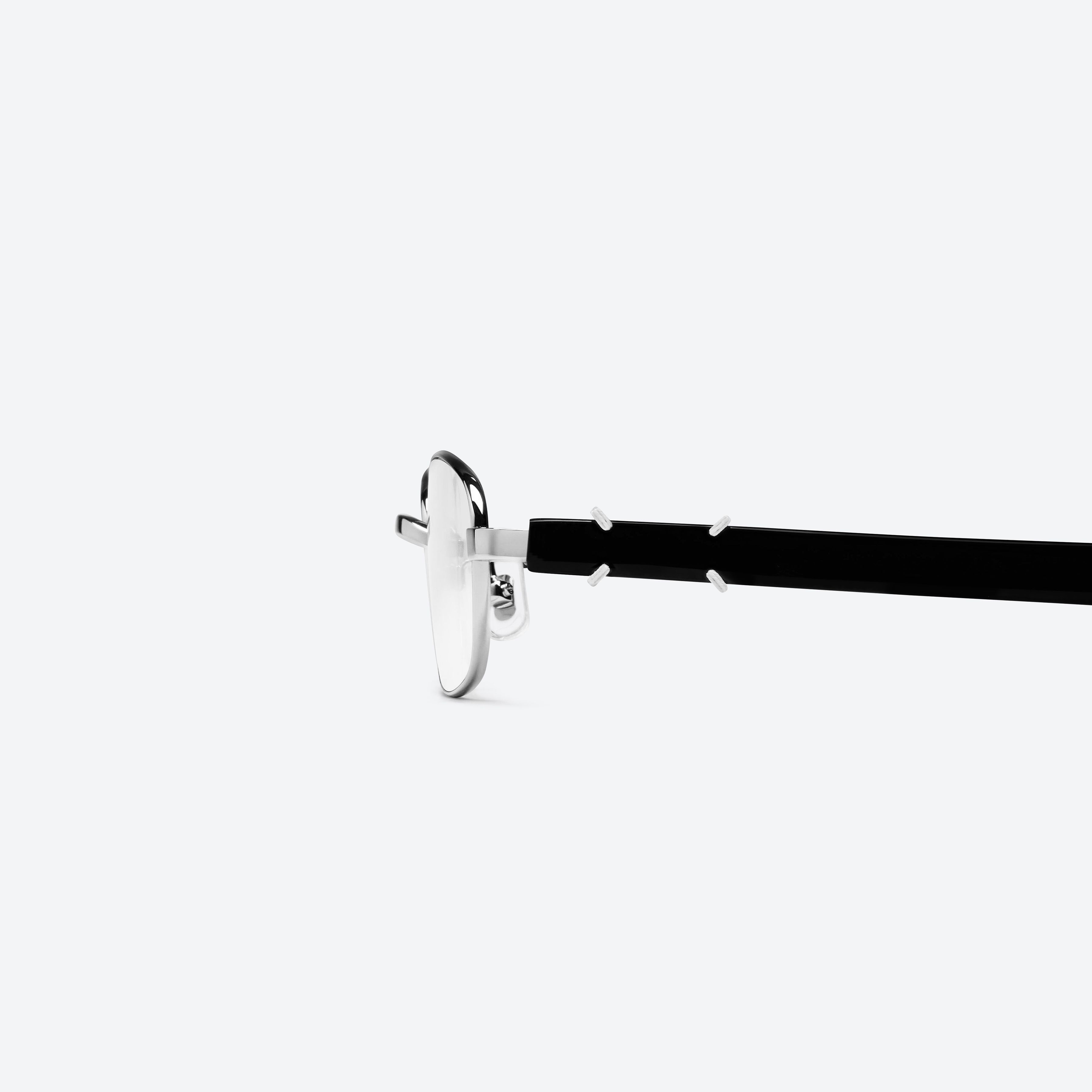 A detailed left view of Gentle Monster Maison Margiela - MM311 02 Silver Mixed framed Square glasses.