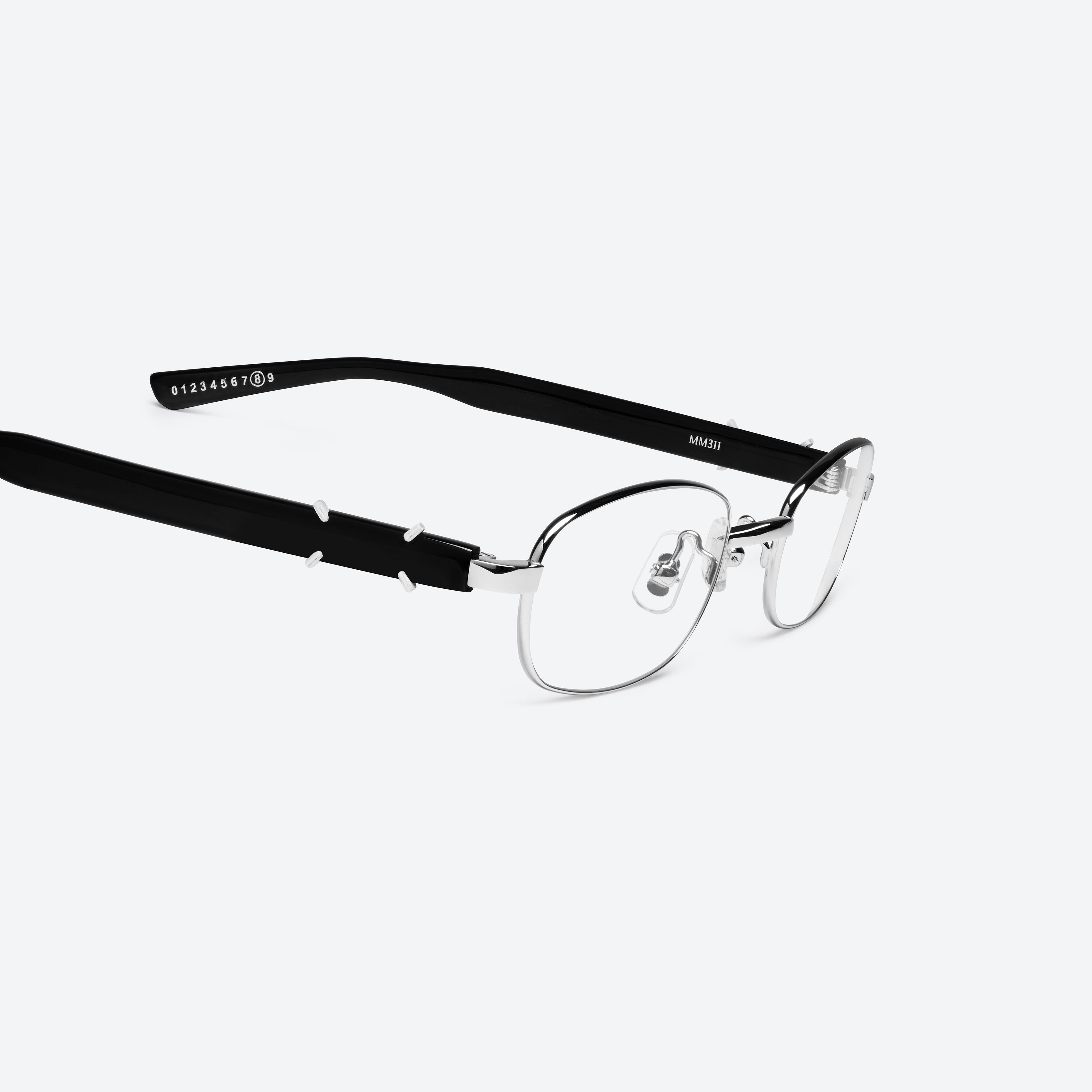 45-degree detailed view of Gentle Monster Maison Margiela - MM311 02 Silver Mixed framed Square glasses.