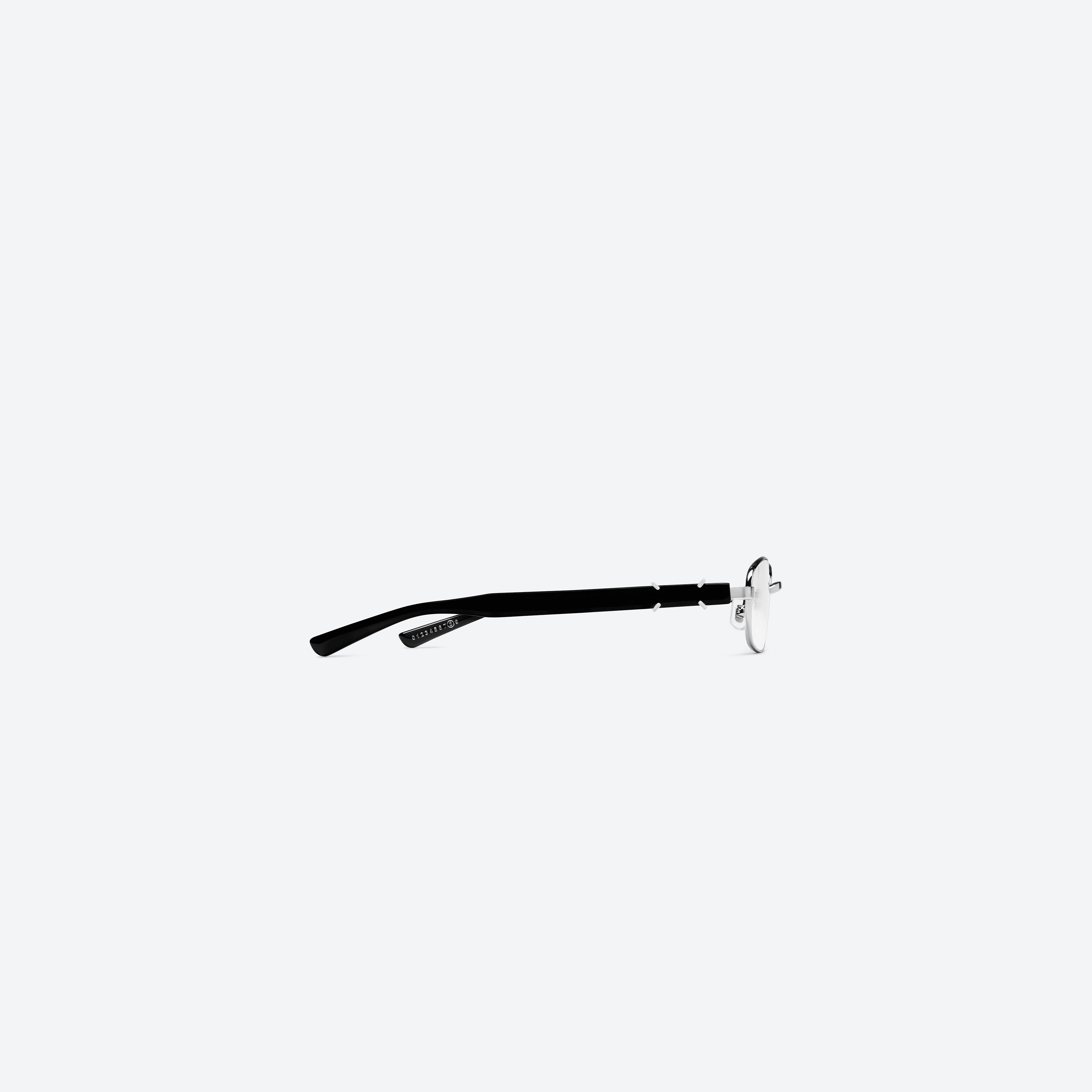 A detailed right view of Gentle Monster Maison Margiela - MM311 02 Silver Mixed framed Square glasses.
